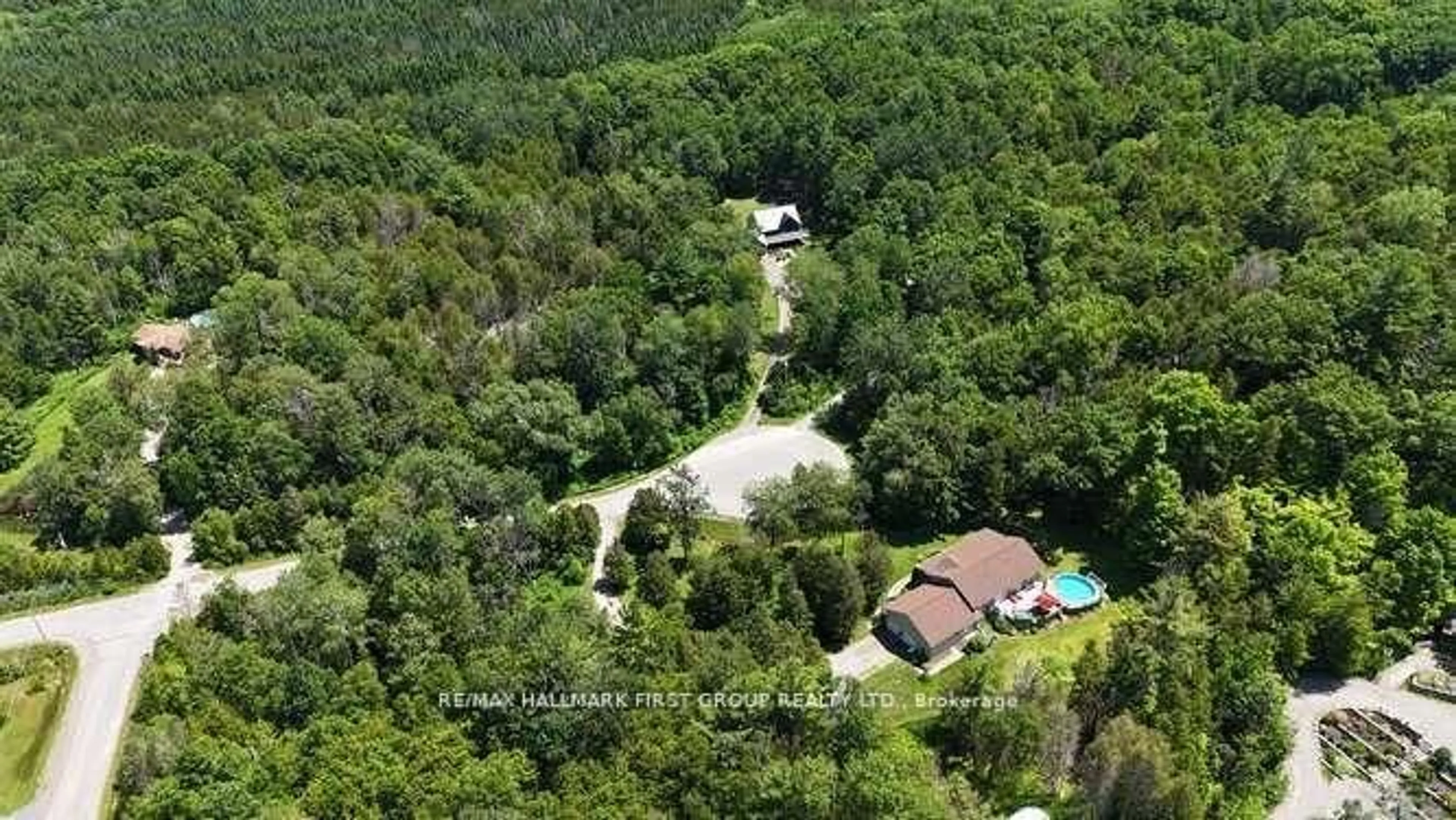 A pic from outside/outdoor area/front of a property/back of a property/a pic from drone, forest/trees view for 715 Whitebirch Rd, Cavan Monaghan Ontario L0A 1G0