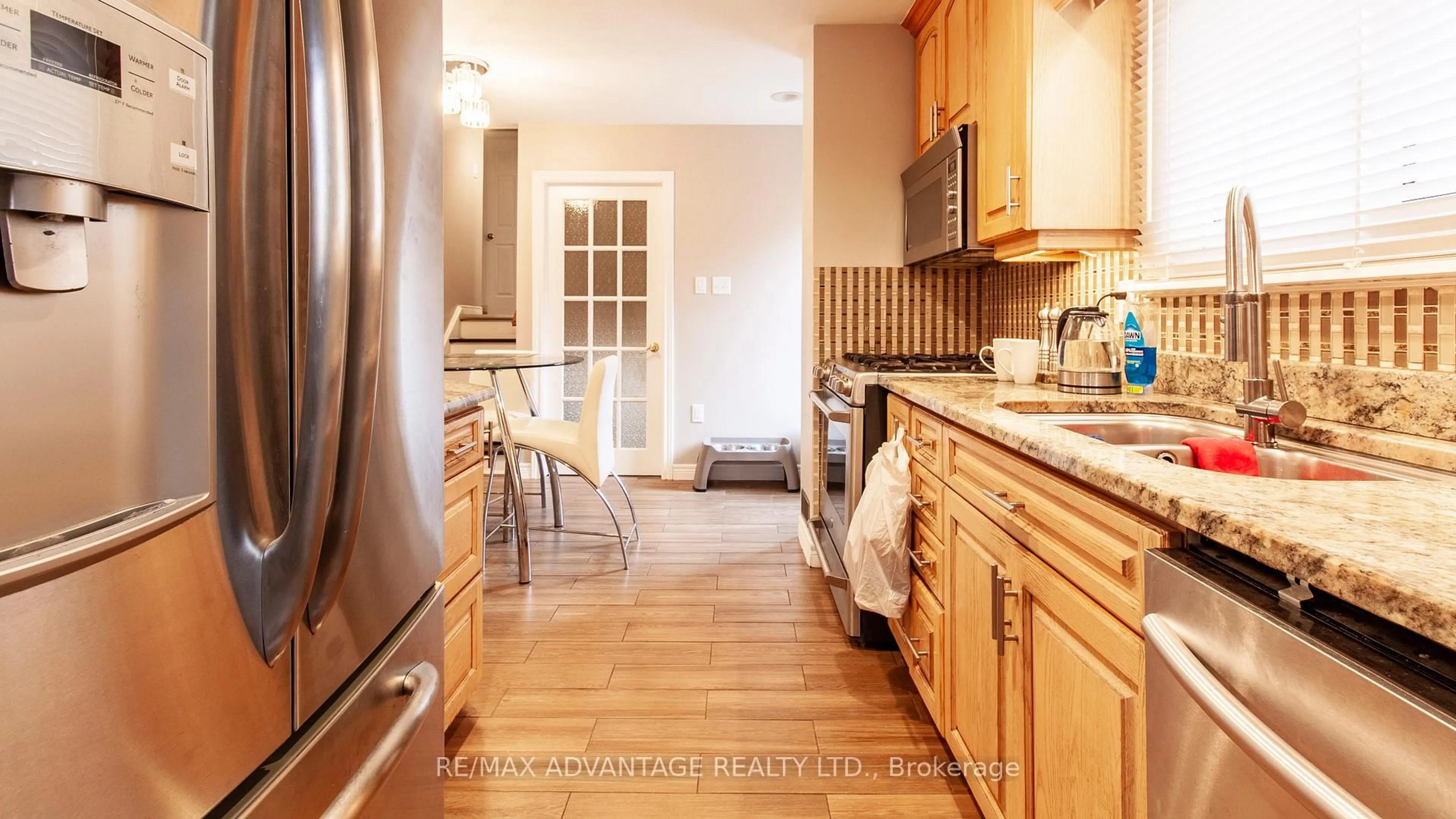 Kitchen with laundary machines, unknown for 419 Ferndale Ave, London South Ontario N6C 2Y9