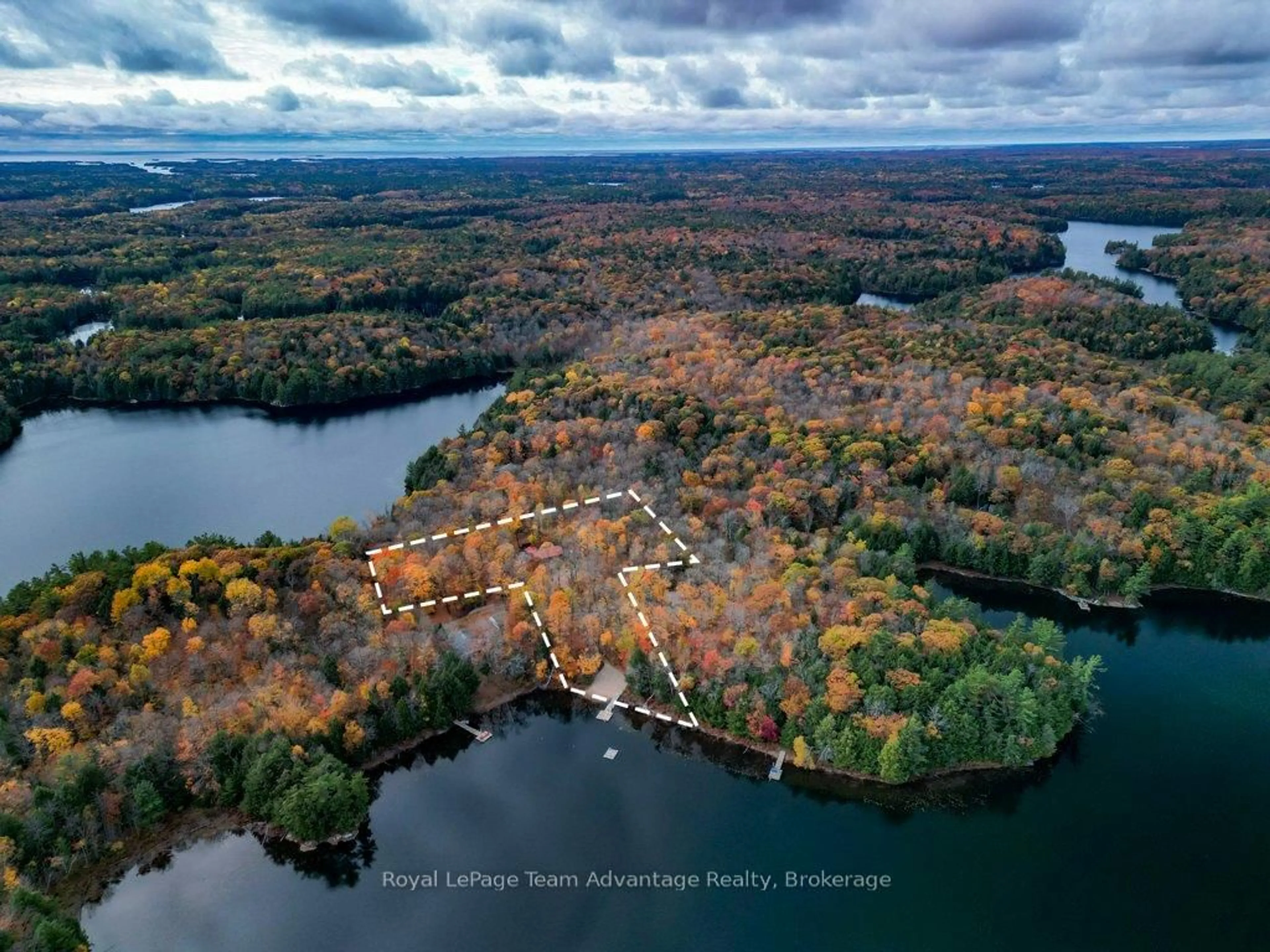 A pic from outside/outdoor area/front of a property/back of a property/a pic from drone, water/lake/river/ocean view for 34 Beechwood Lane, Seguin Ontario P2A 0B2