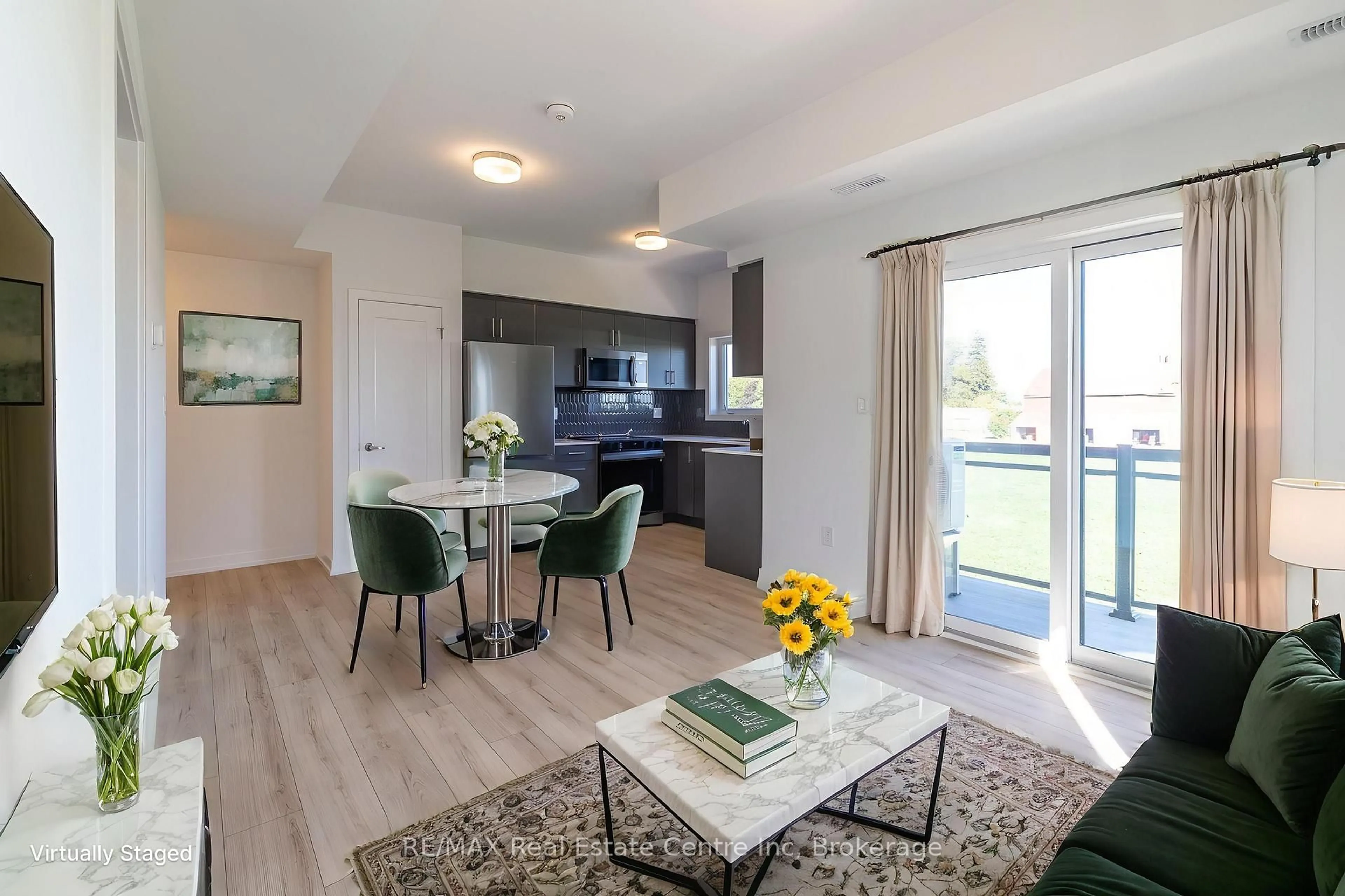 Open concept kitchen, wood/laminate floor for 940 St.David St #60, Centre Wellington Ontario N1M 2W3