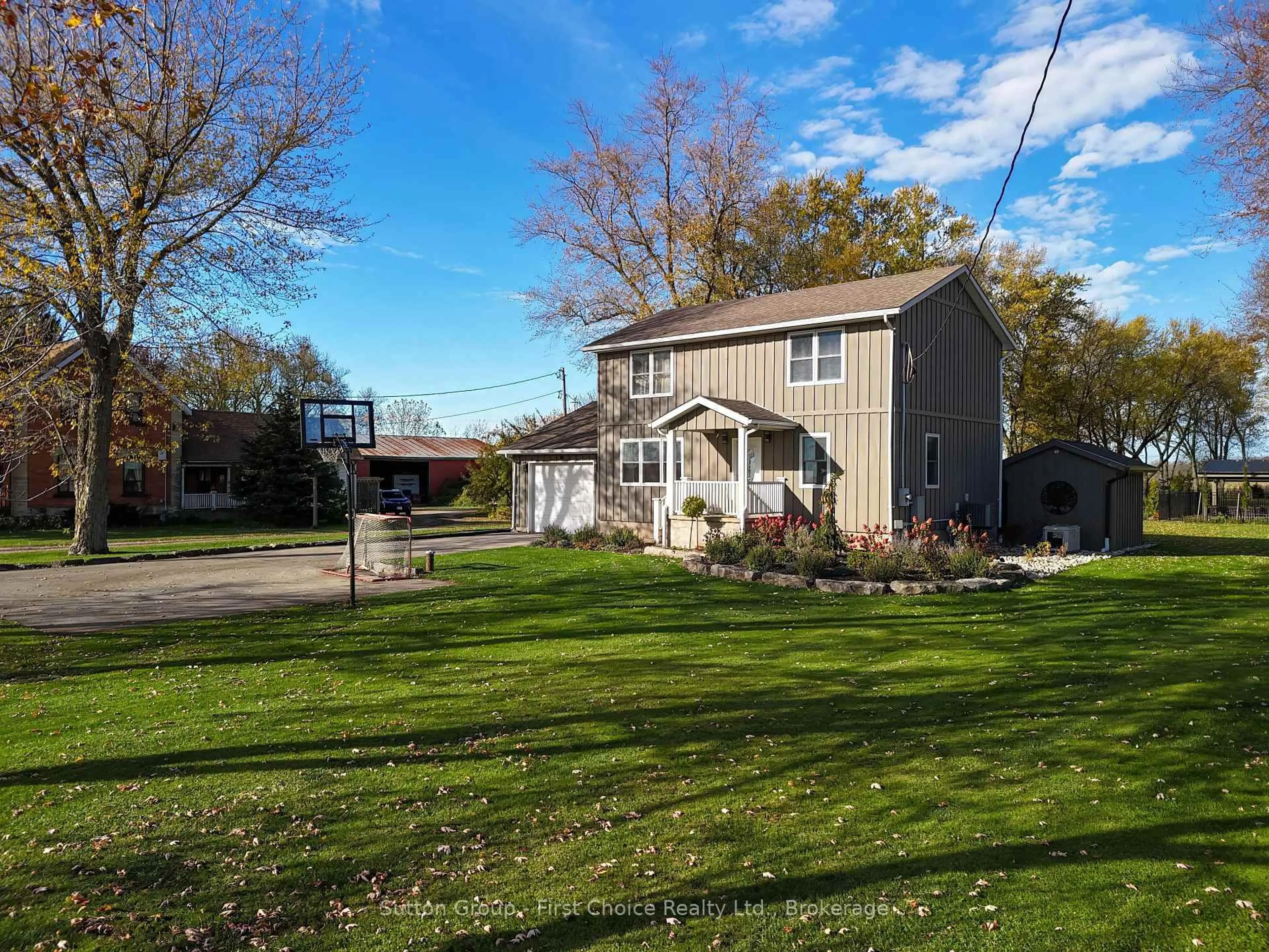 A pic from outside/outdoor area/front of a property/back of a property/a pic from drone, street for 3502 Highway 7, Perth South Ontario N5A 6S3