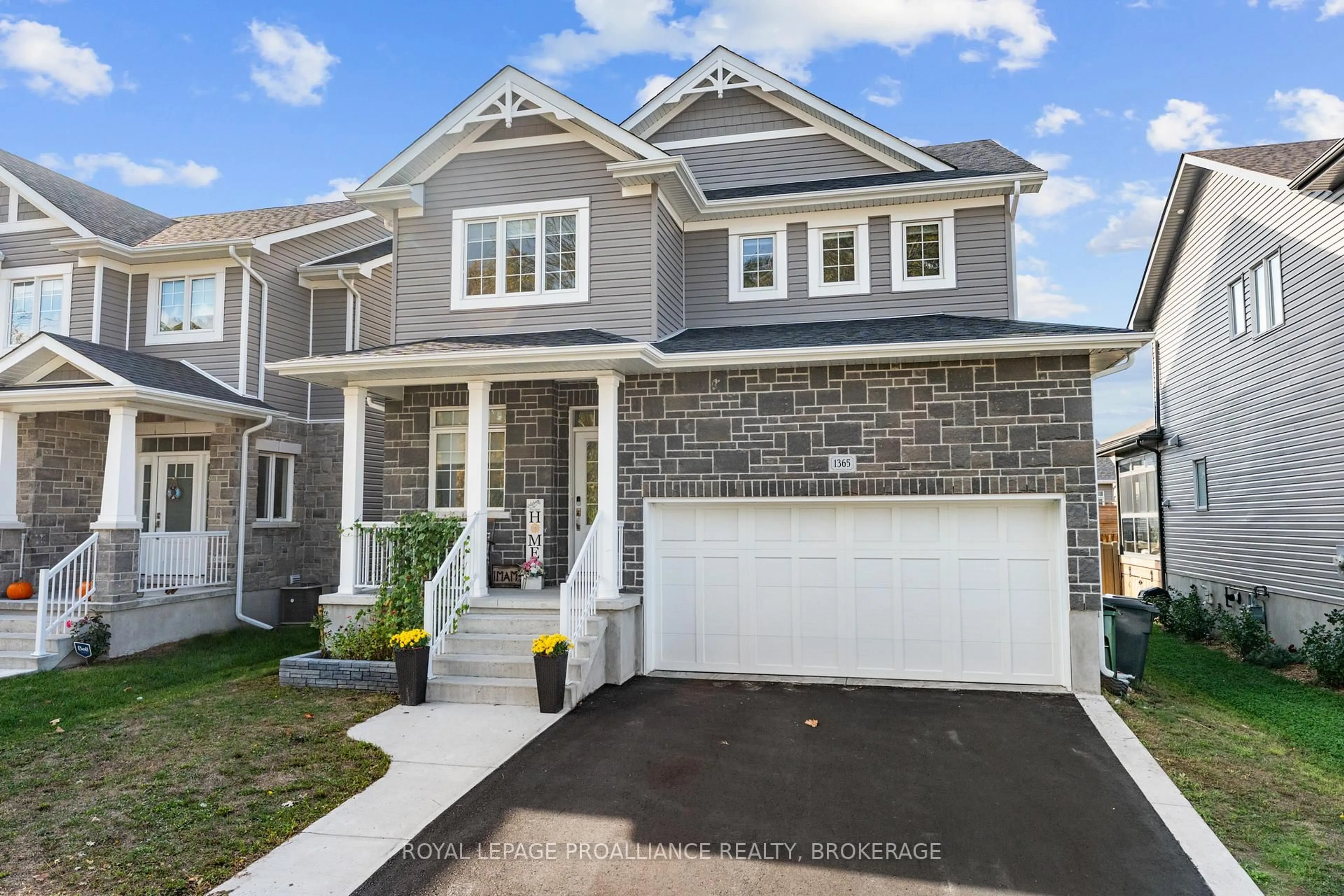 Home with vinyl exterior material, street for 1365 Andersen Dr, Kingston Ontario K7P 0P5