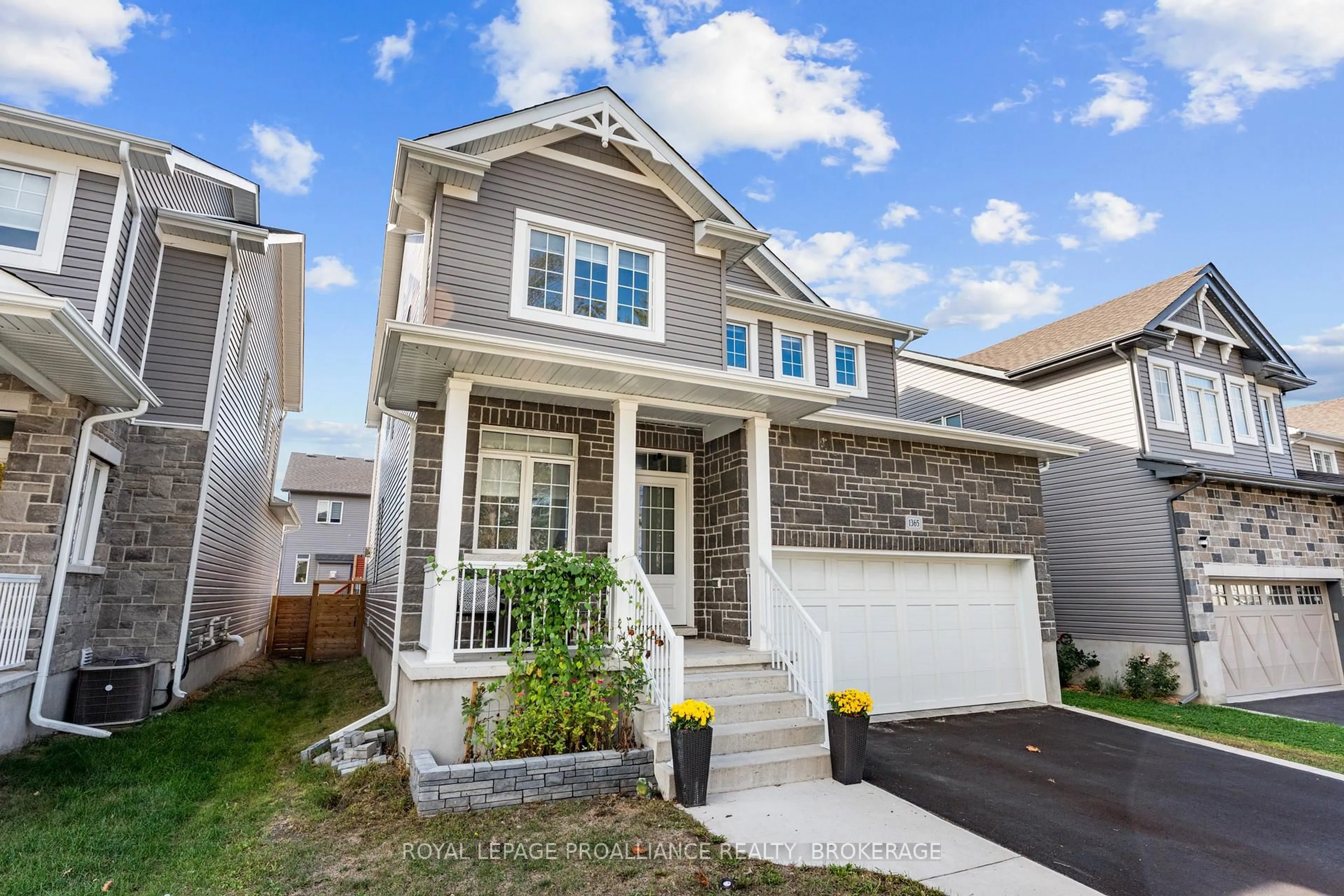 Home with vinyl exterior material, street for 1365 Andersen Dr, Kingston Ontario K7P 0P5