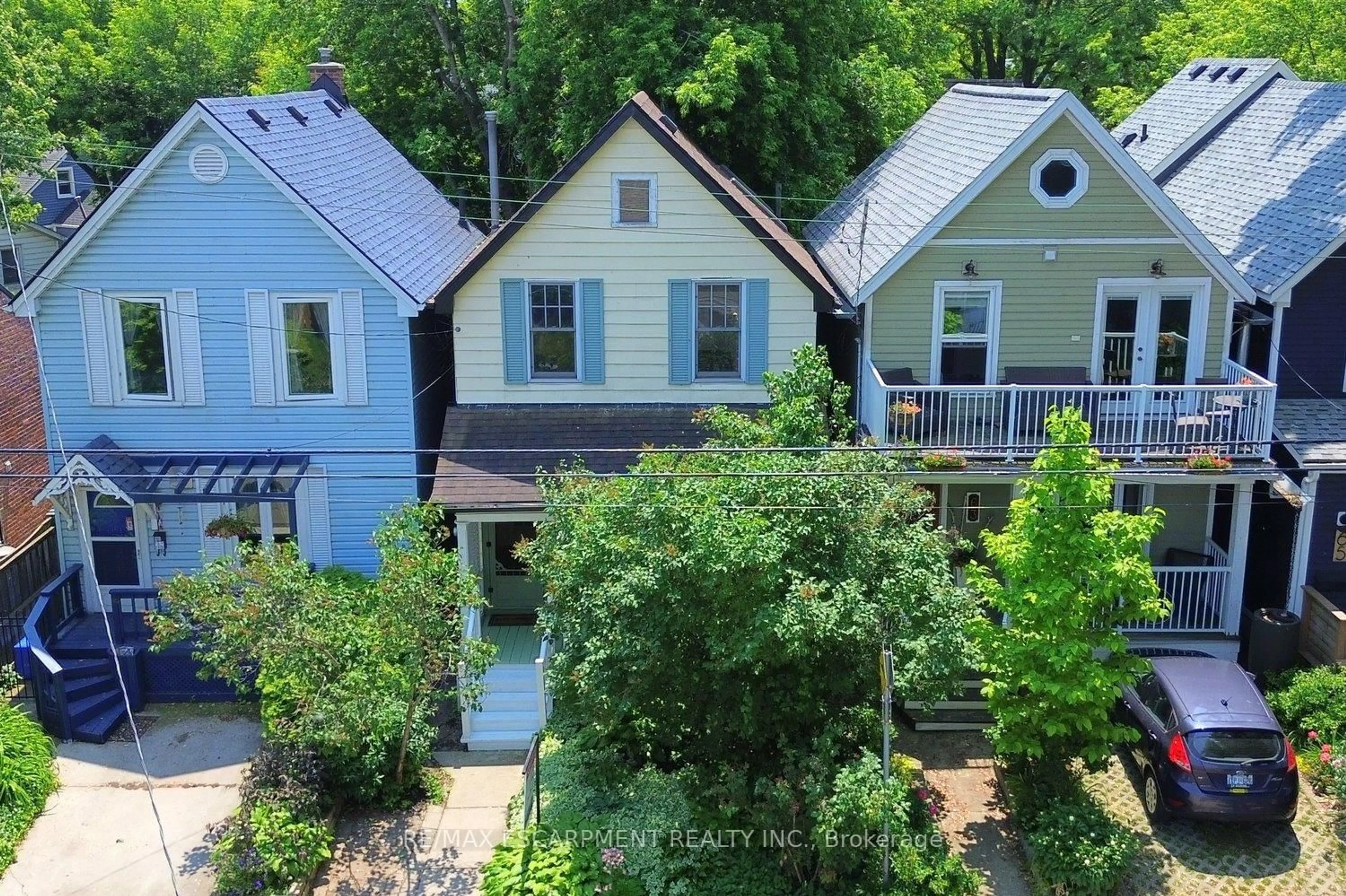 A pic from outside/outdoor area/front of a property/back of a property/a pic from drone, street for 61 Burlington St, Hamilton Ontario L8L 1G6