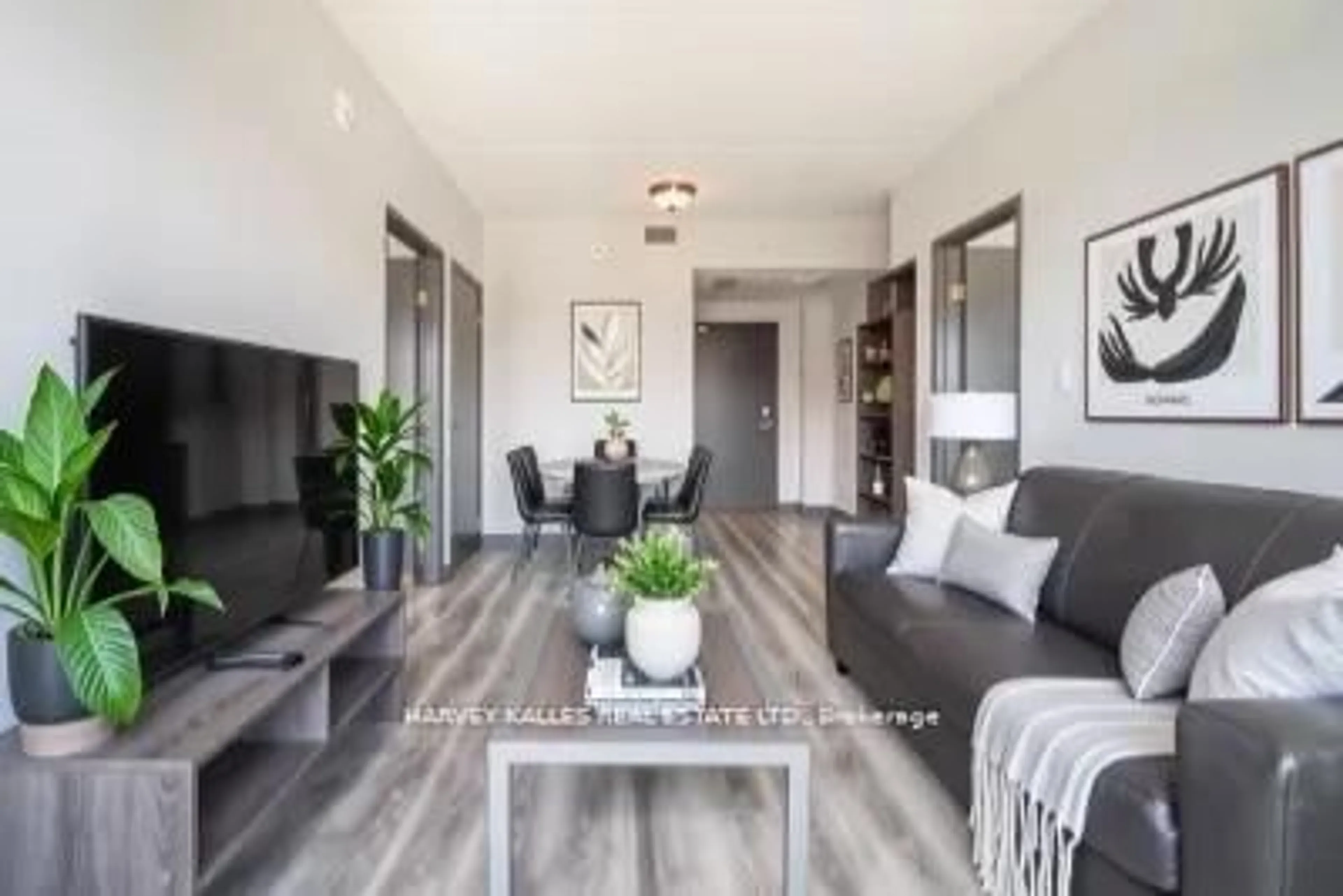 Living room with furniture, wood/laminate floor for 275 Larch St #A502, Waterloo Ontario N2L 3R2