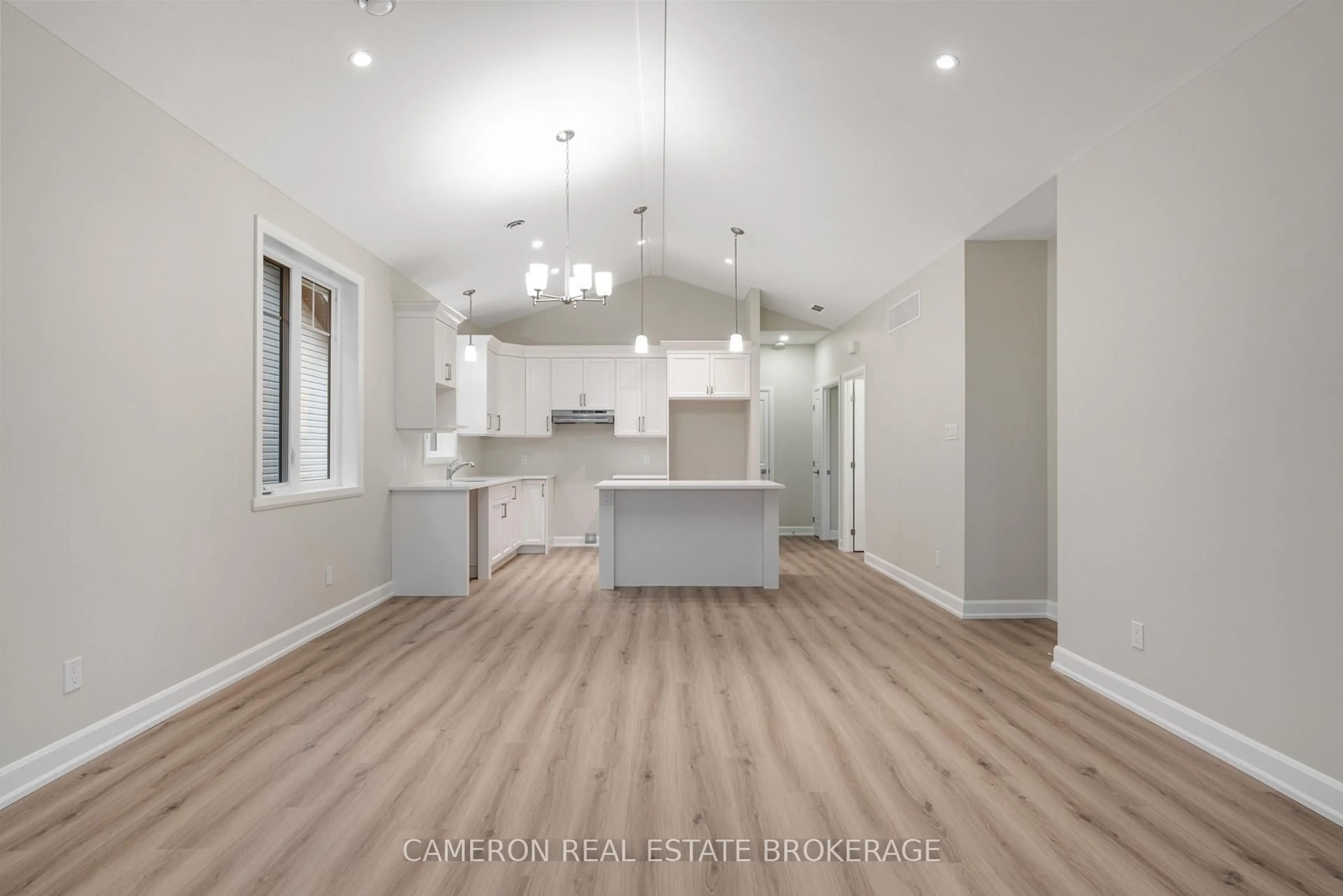 Open concept kitchen, wood/laminate floor for 3149 Mauricy St, Cornwall Ontario K6K 0A1