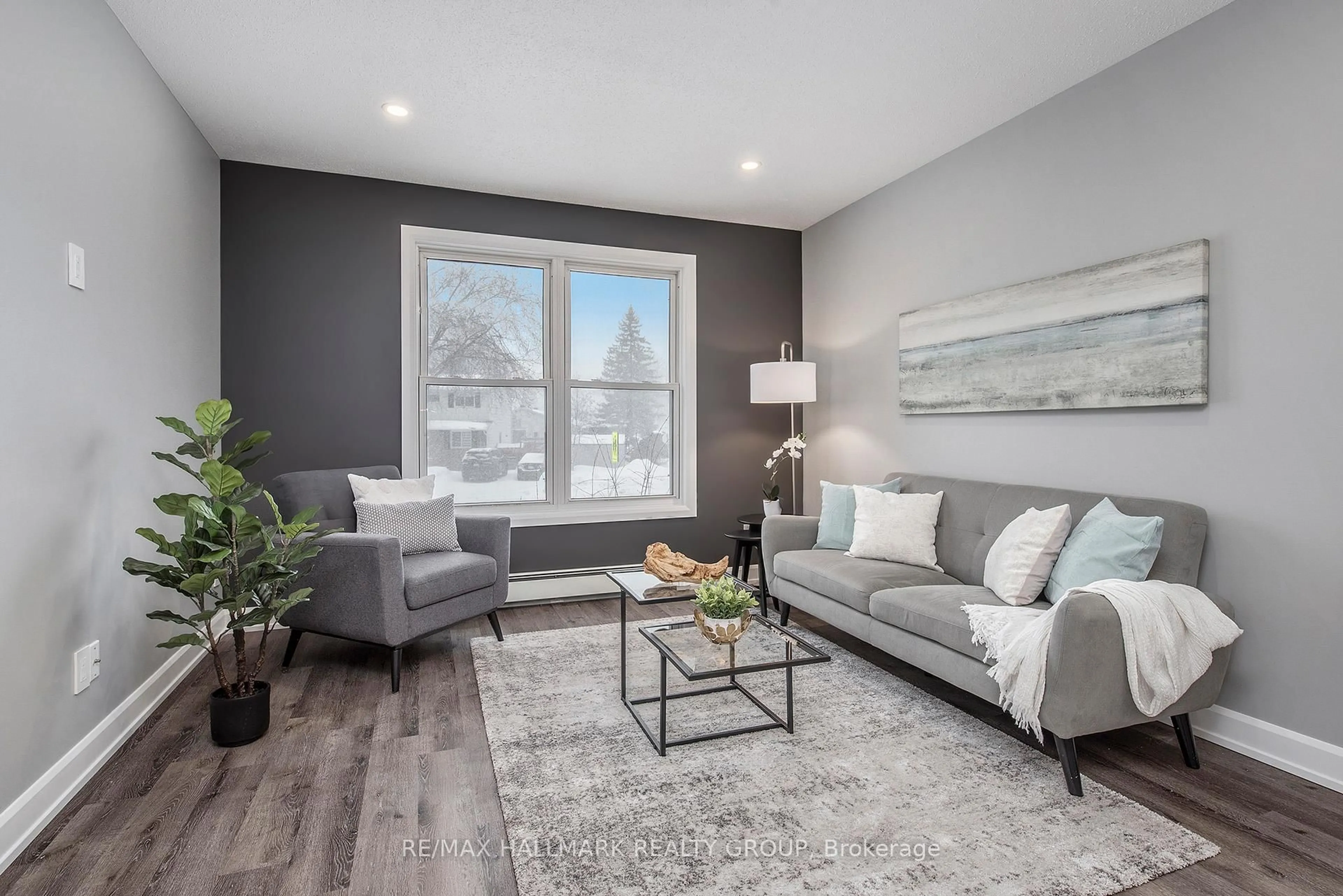 Living room with furniture, wood/laminate floor for 242 Castlefrank Rd, Kanata Ontario K2L 1T5