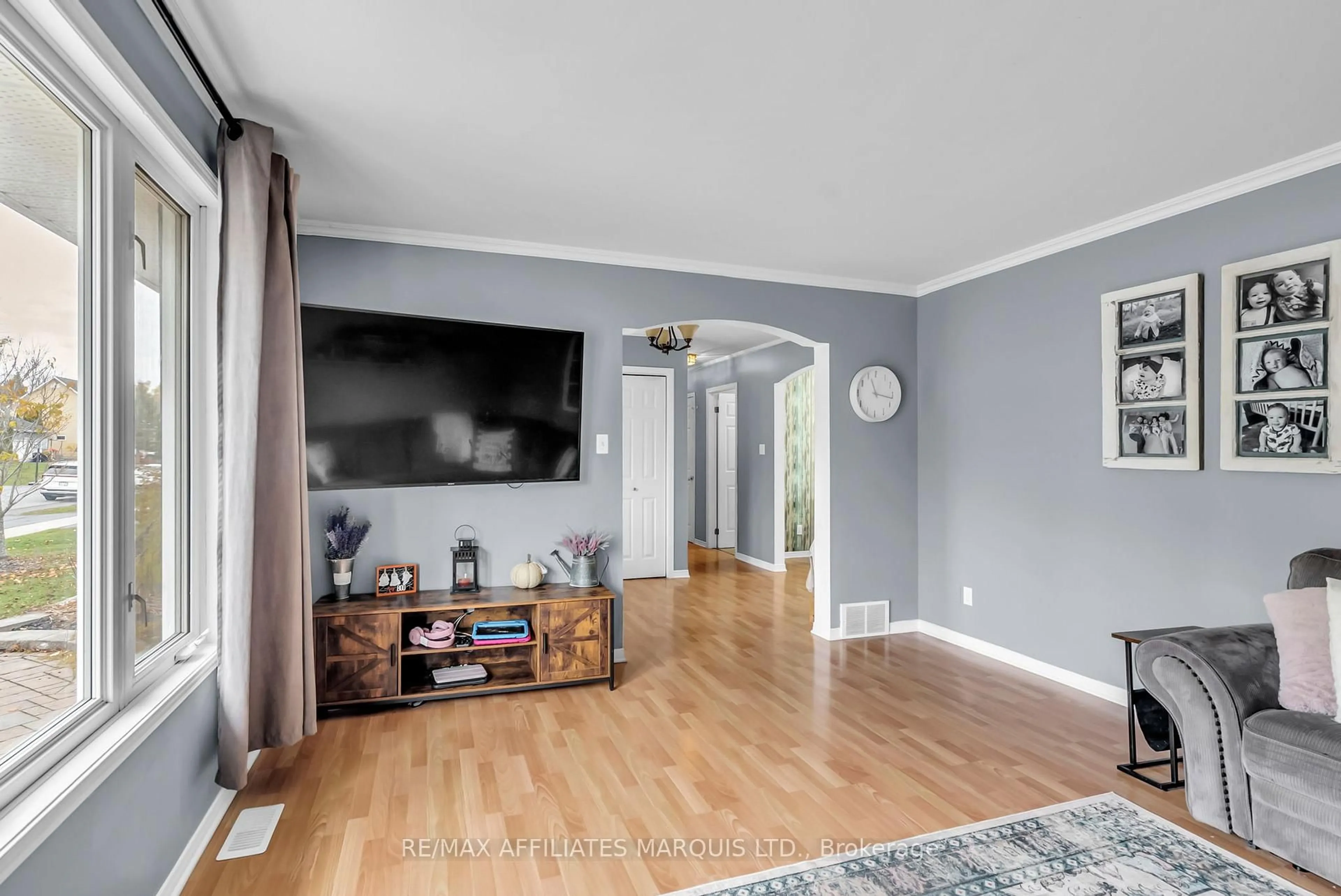 Living room with furniture, wood/laminate floor for 17 Napier St, South Stormont Ontario K0C 1M0