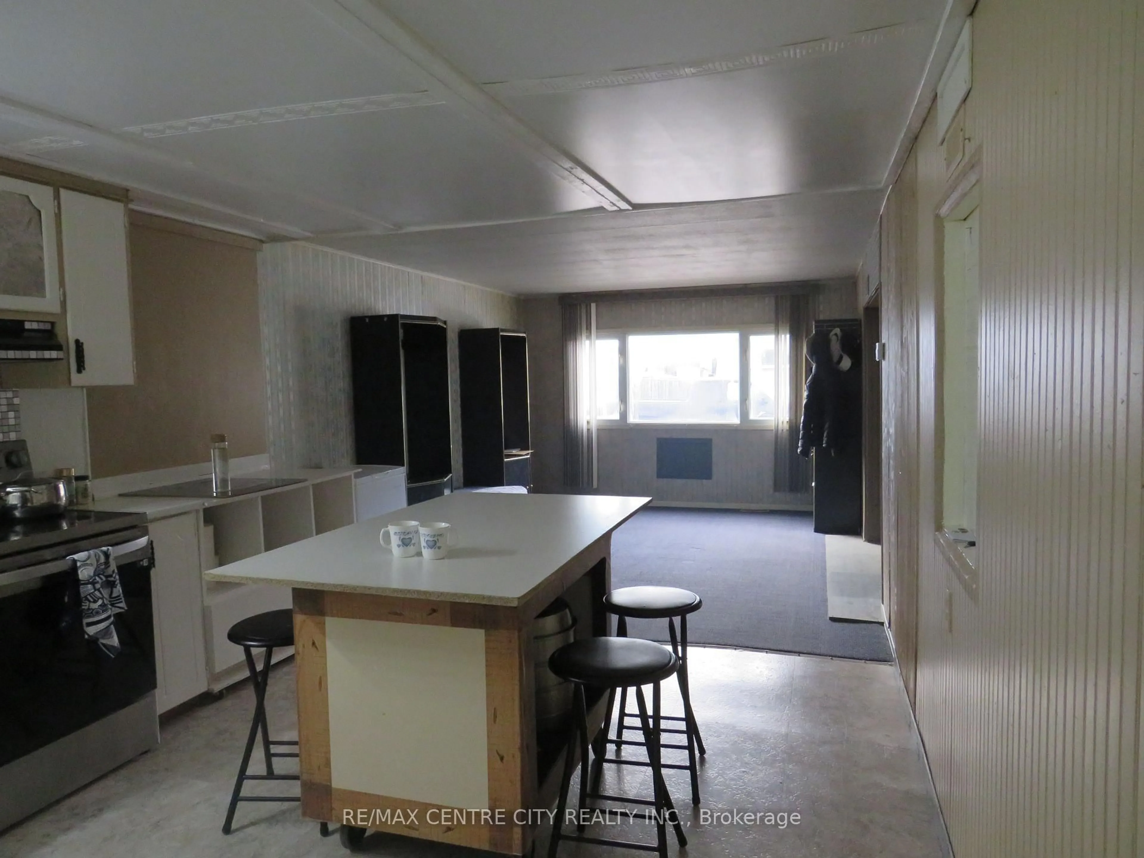 Kitchen with laundary machines, unknown for 3902 Dundas St #4, Thames Centre Ontario N5V 5C6