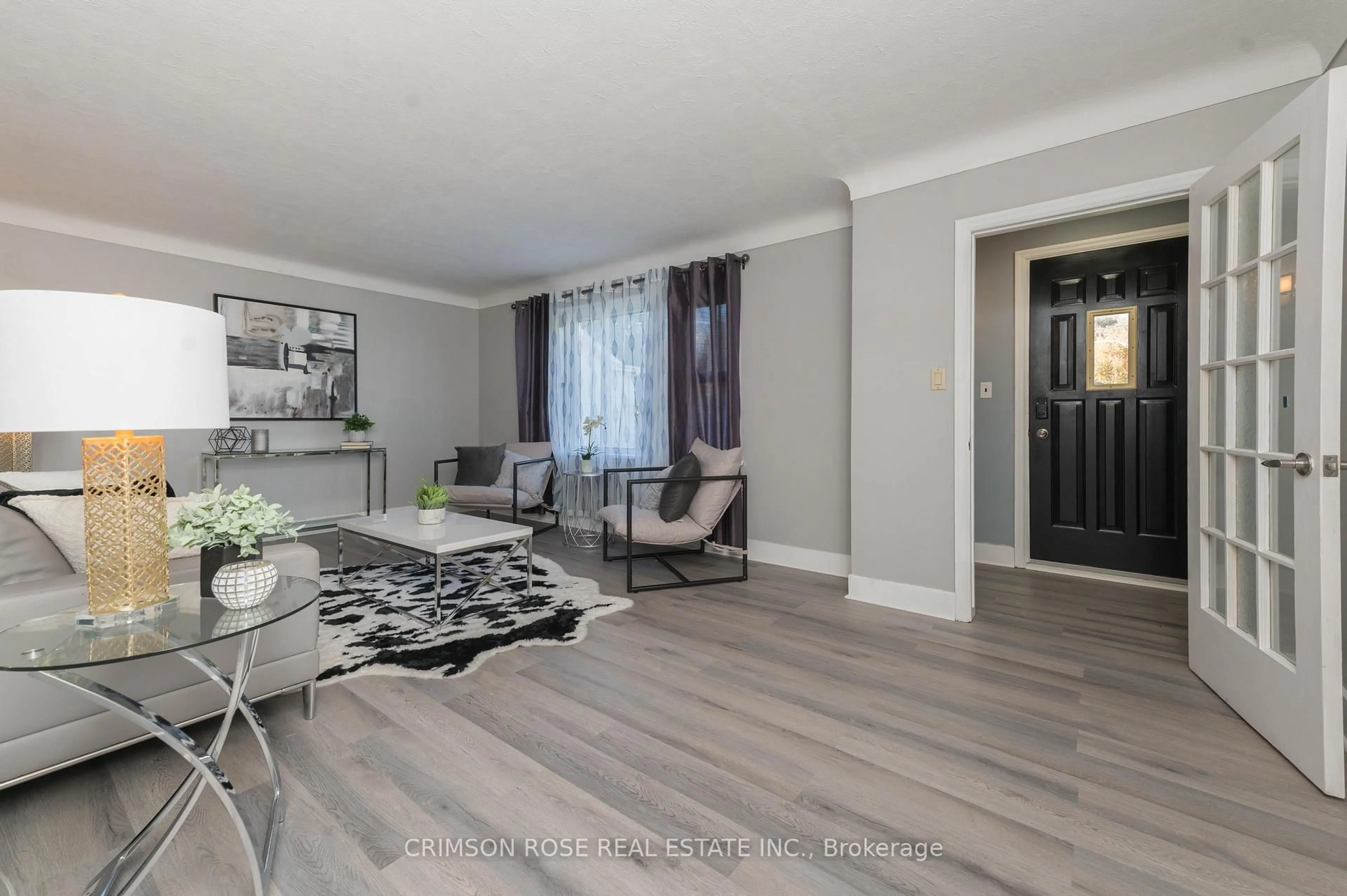 Living room with furniture, wood/laminate floor for 11 Bonavem Dr, St. Catharines Ontario L2N 1X7