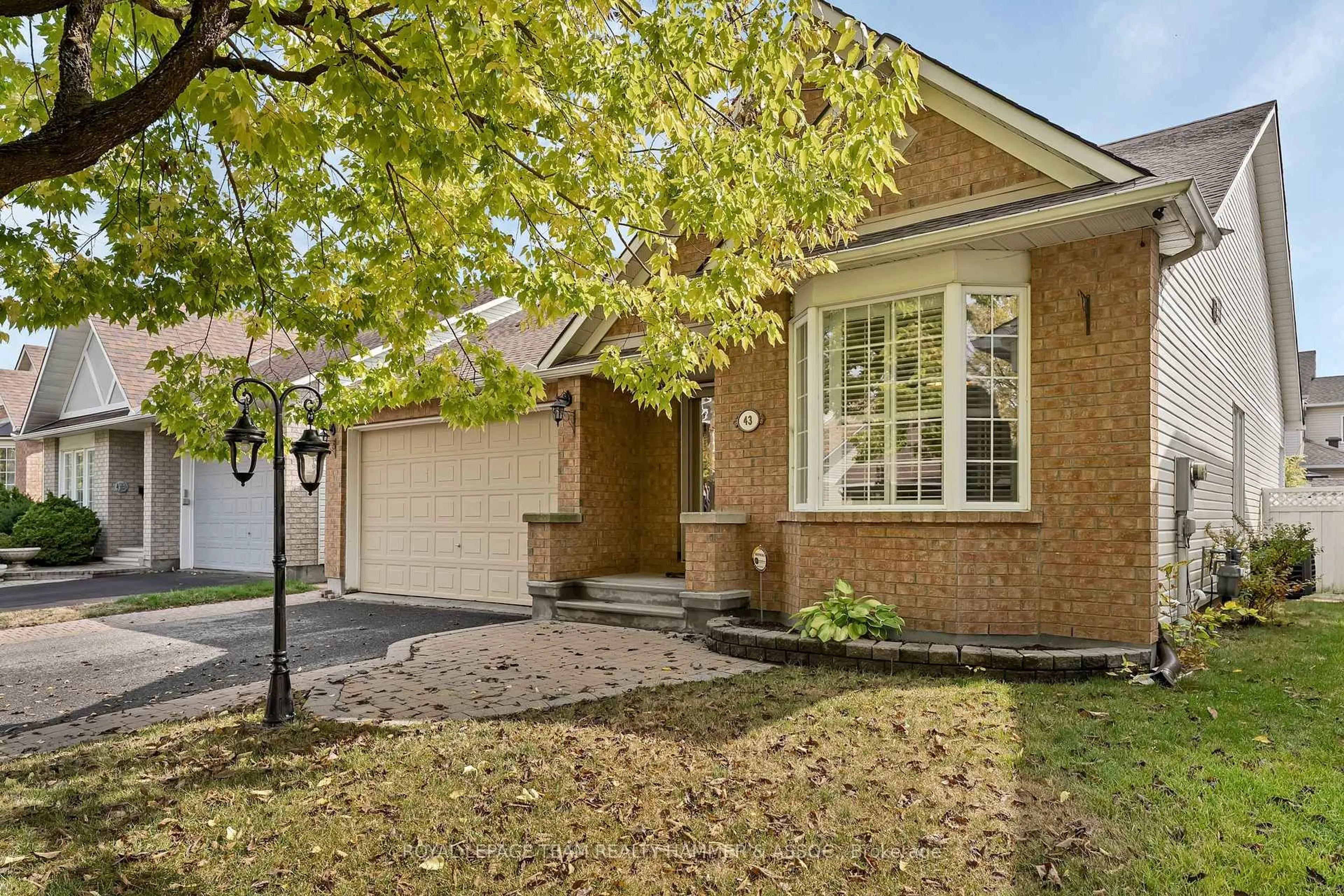 Home with brick exterior material, street for 43 Settler's Ridge Way, Ottawa Ontario K2J 4V2