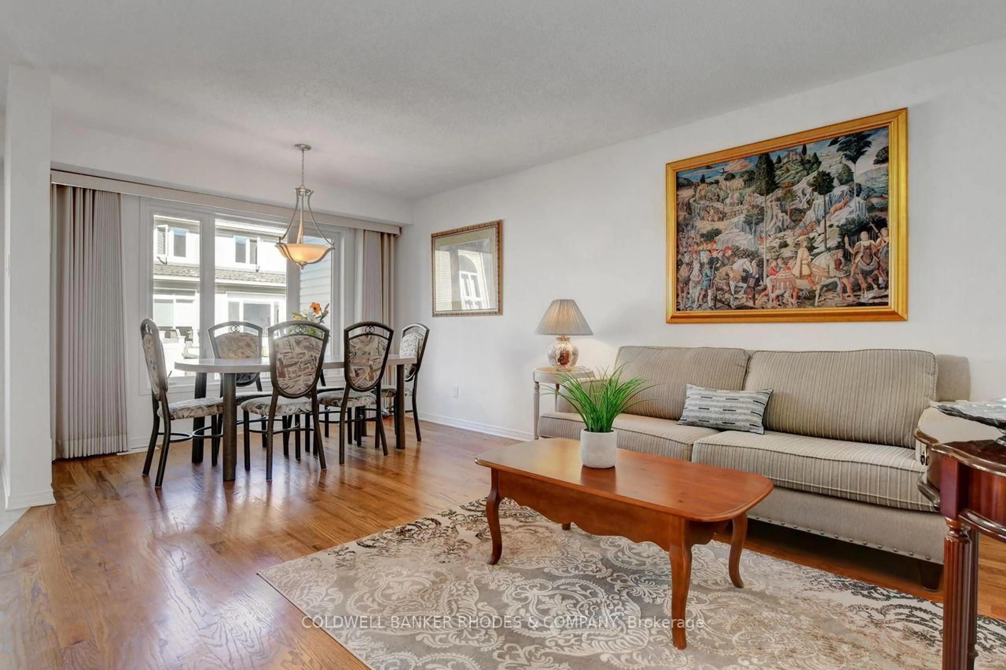 Living room with furniture, wood/laminate floor for 287 Macoun Circ, Ottawa Ontario K1T 0H8