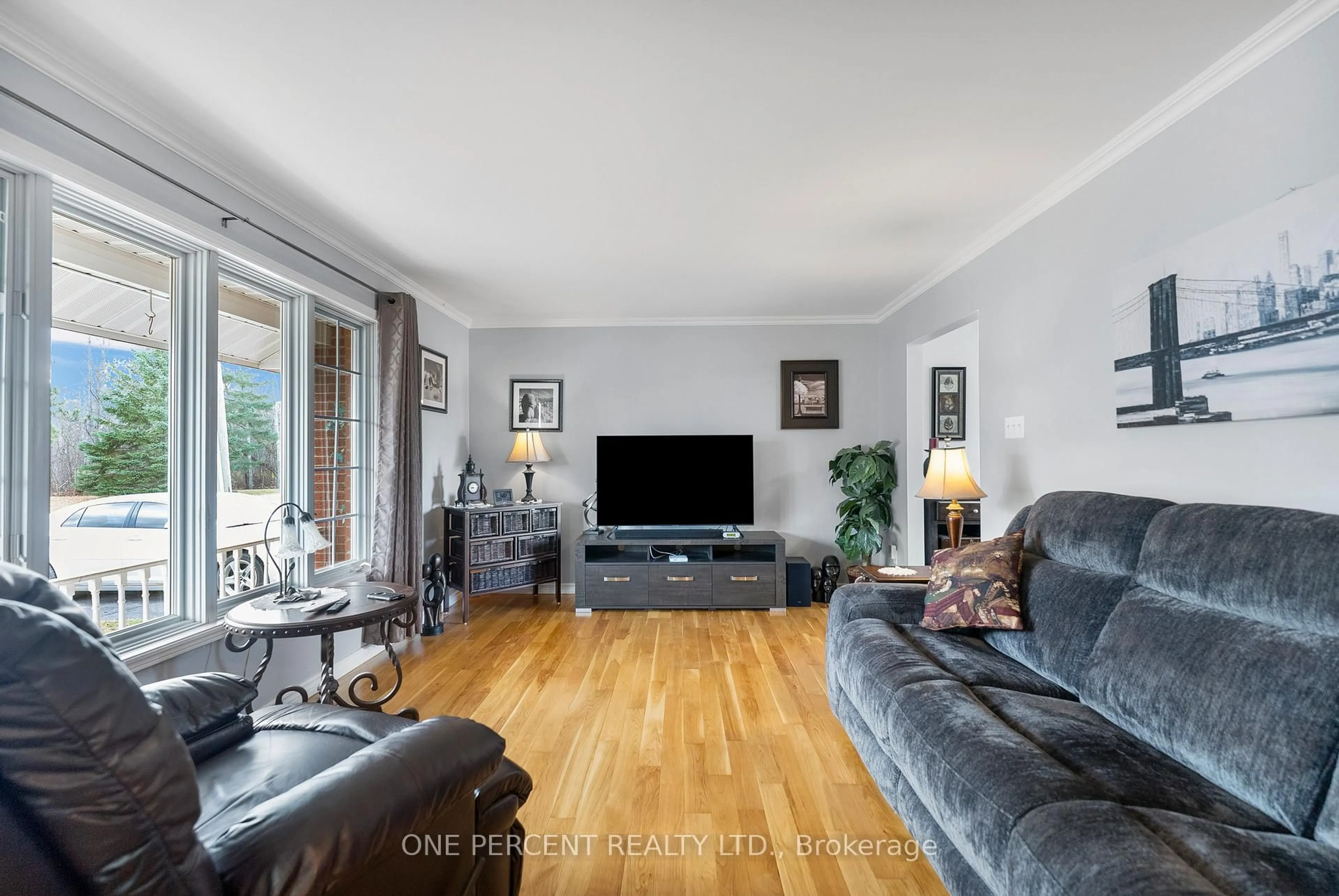 Living room with furniture, wood/laminate floor for 626 Willow Dr, Laurentian Valley Ontario K8A 4J1