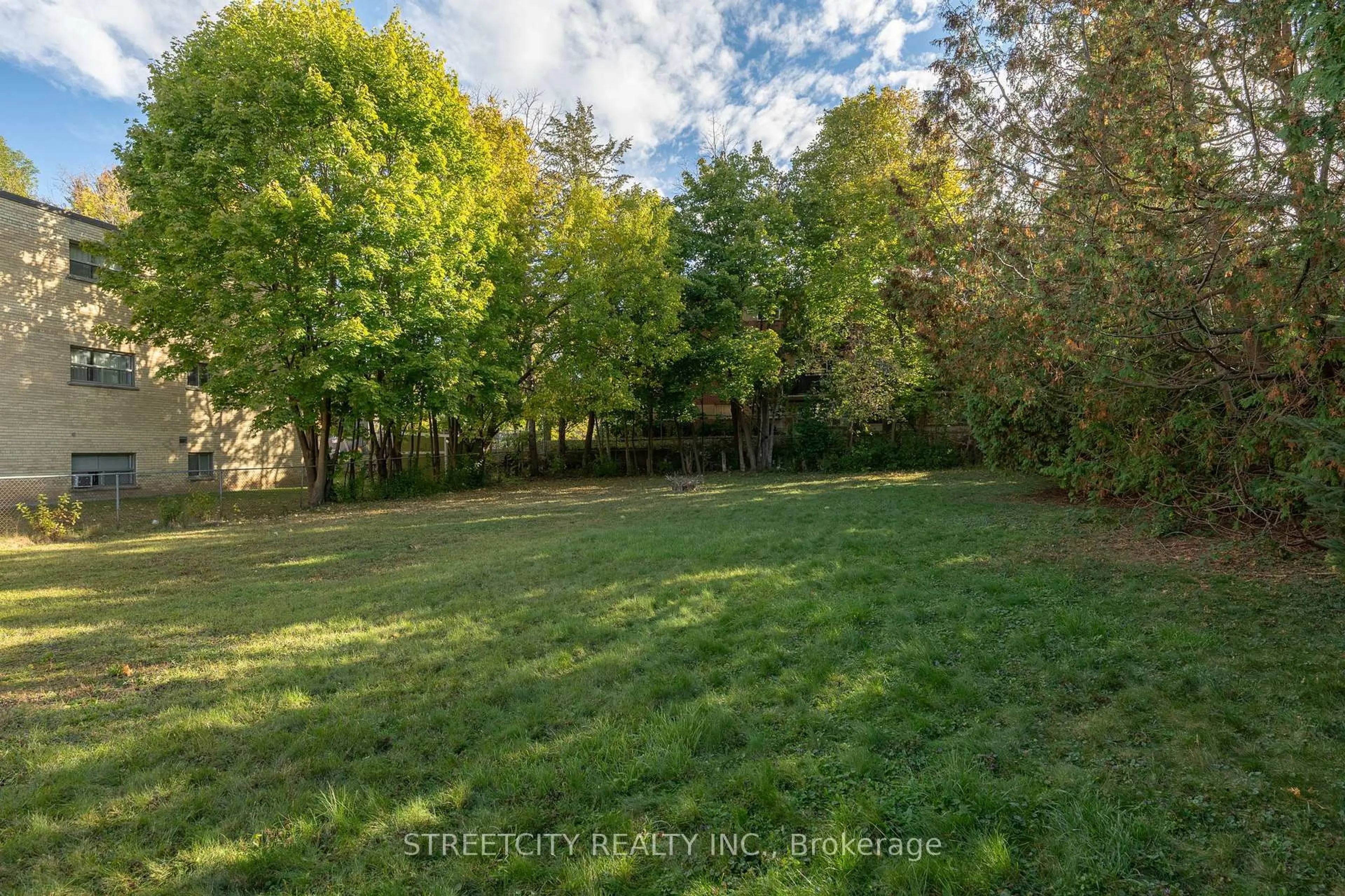 A pic from outside/outdoor area/front of a property/back of a property/a pic from drone, forest/trees view for 312 Fairview Ave, London South Ontario N6C 4T8