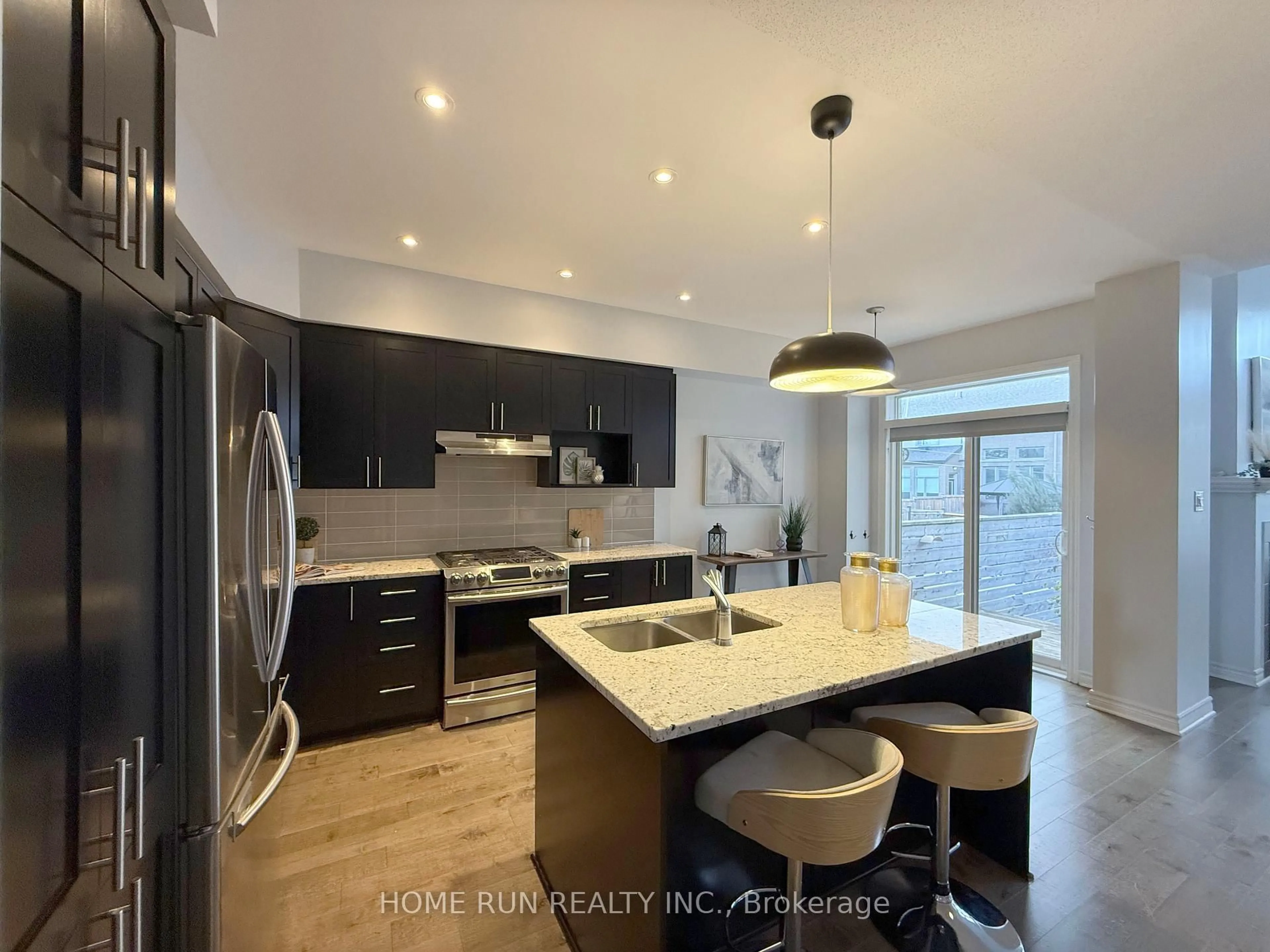 Open concept kitchen, wood/laminate floor for 781 Brian Good Ave, Ottawa Ontario K4M 0E3
