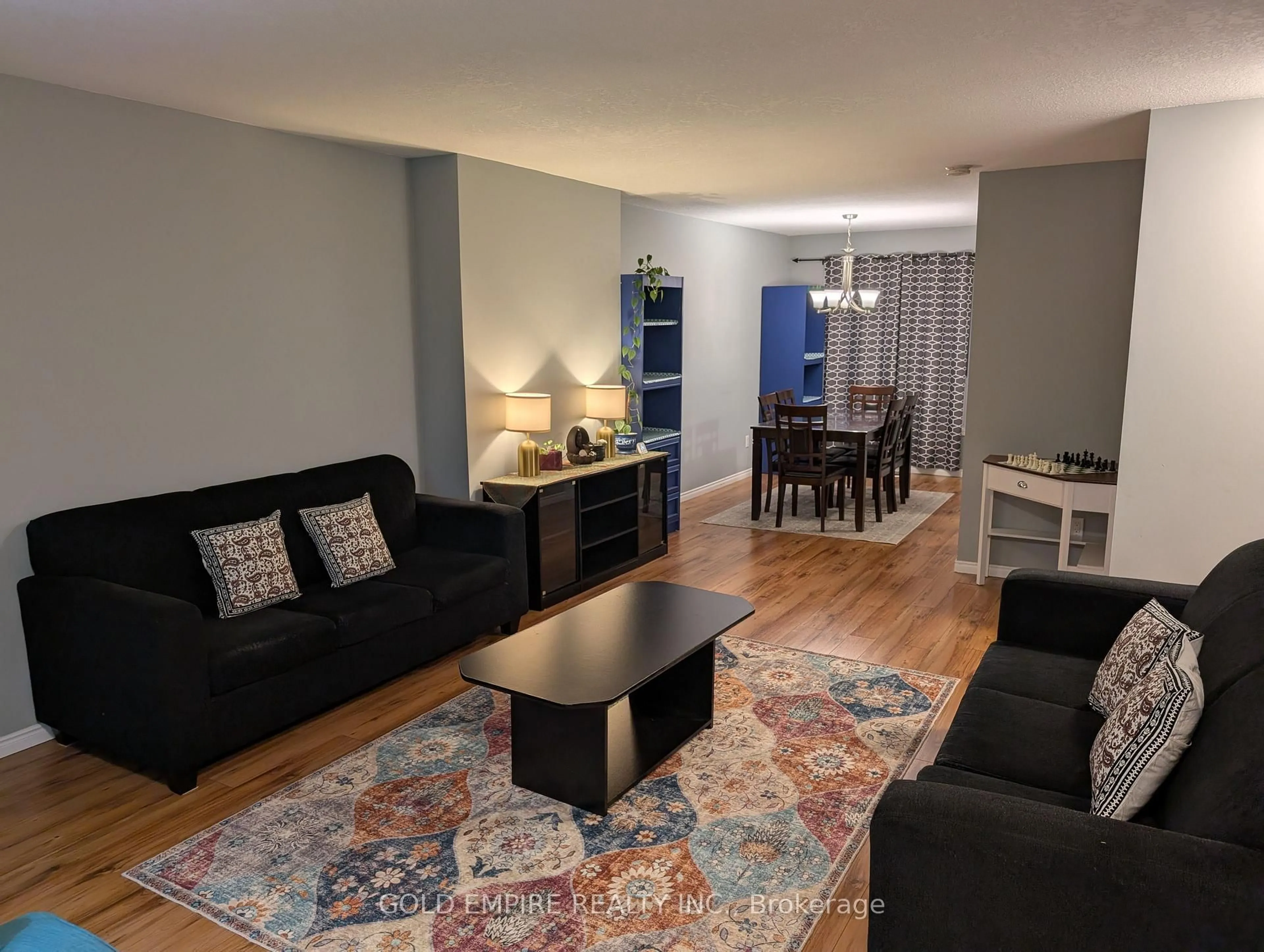 Living room with furniture, wood/laminate floor for 925 LAWSON Rd #40, London North Ontario N6G 4X3