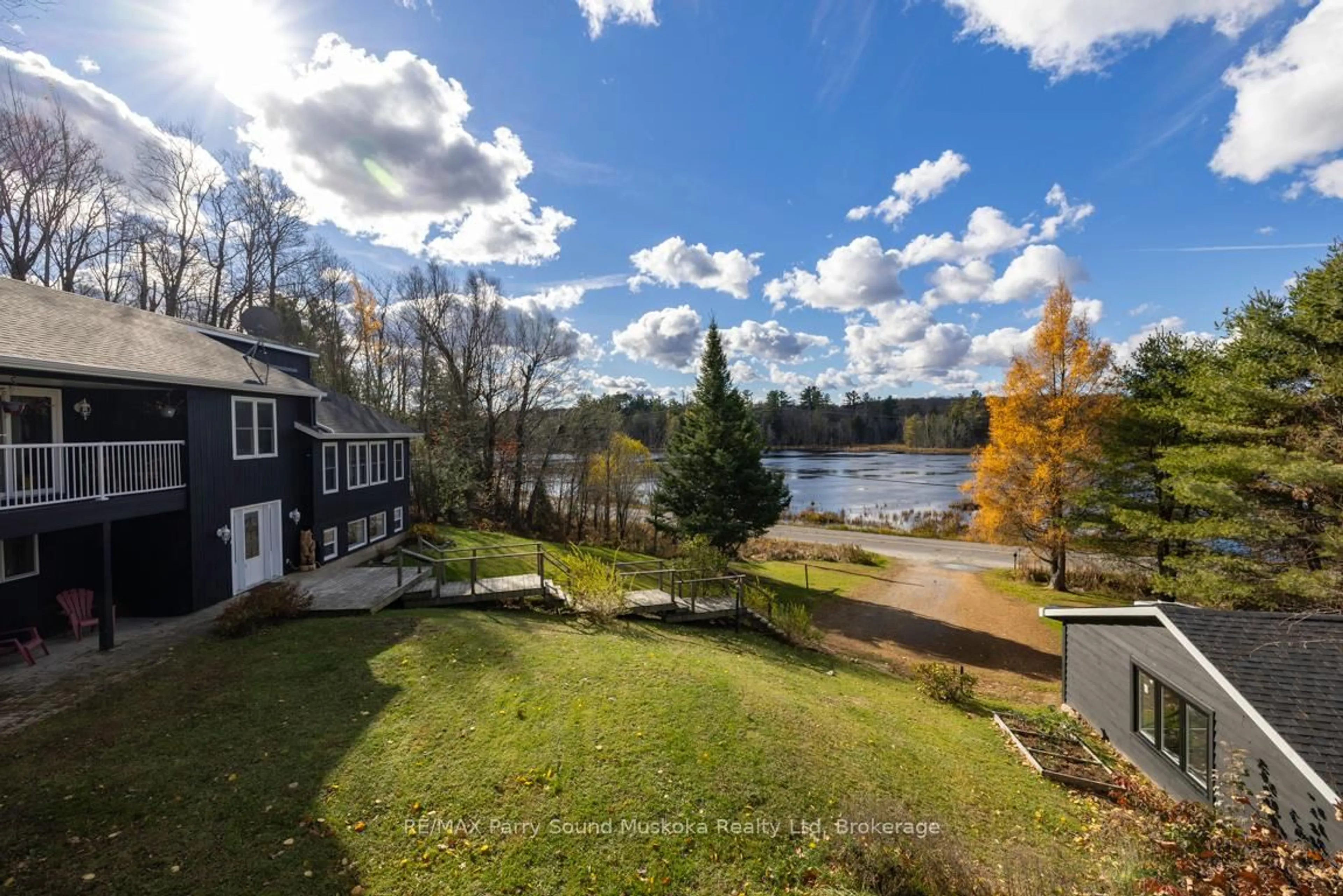 A pic from outside/outdoor area/front of a property/back of a property/a pic from drone, water/lake/river/ocean view for 336 Clear Lake Rd, Seguin Ontario P2A 2W8