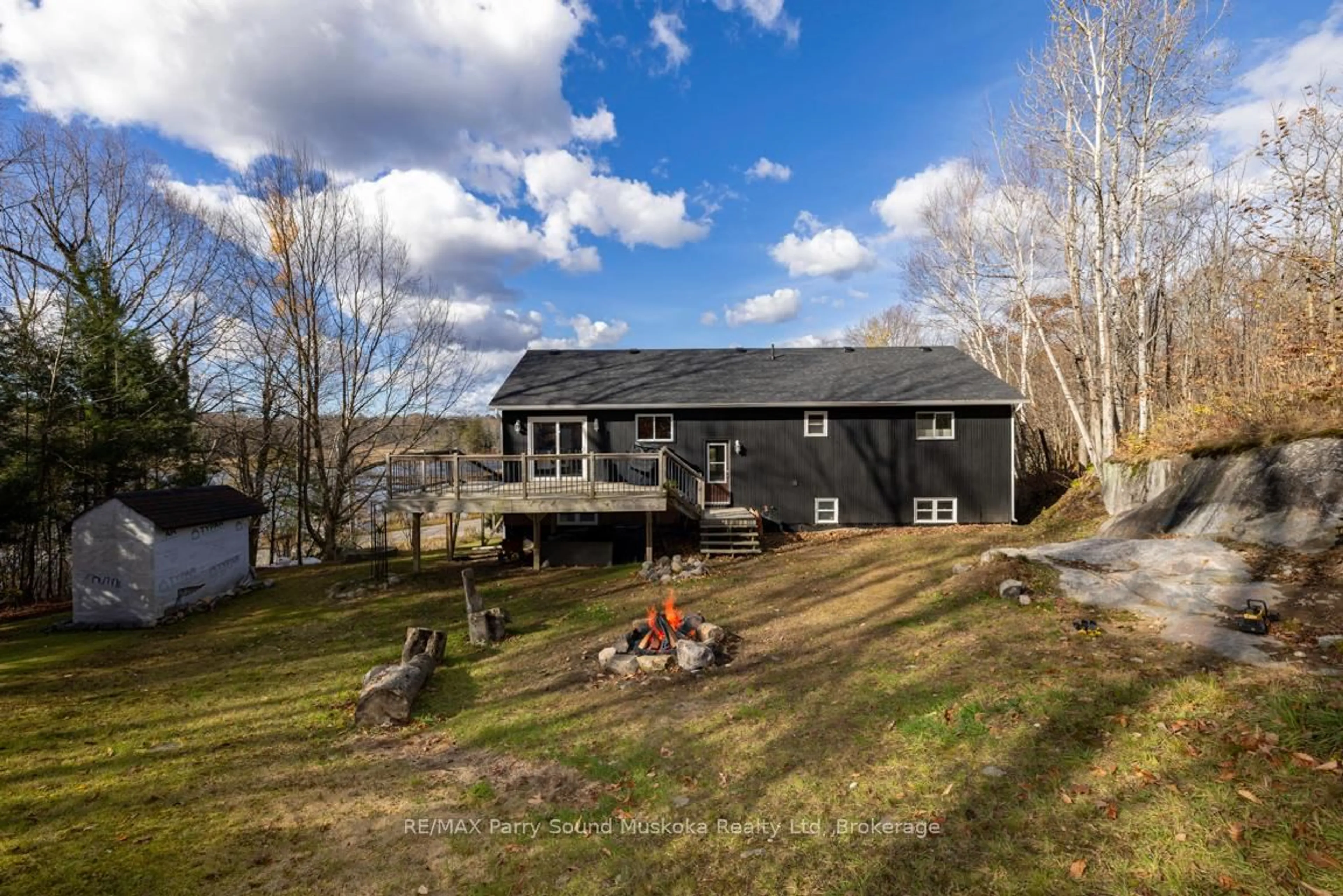 A pic from outside/outdoor area/front of a property/back of a property/a pic from drone, water/lake/river/ocean view for 336 Clear Lake Rd, Seguin Ontario P2A 2W8