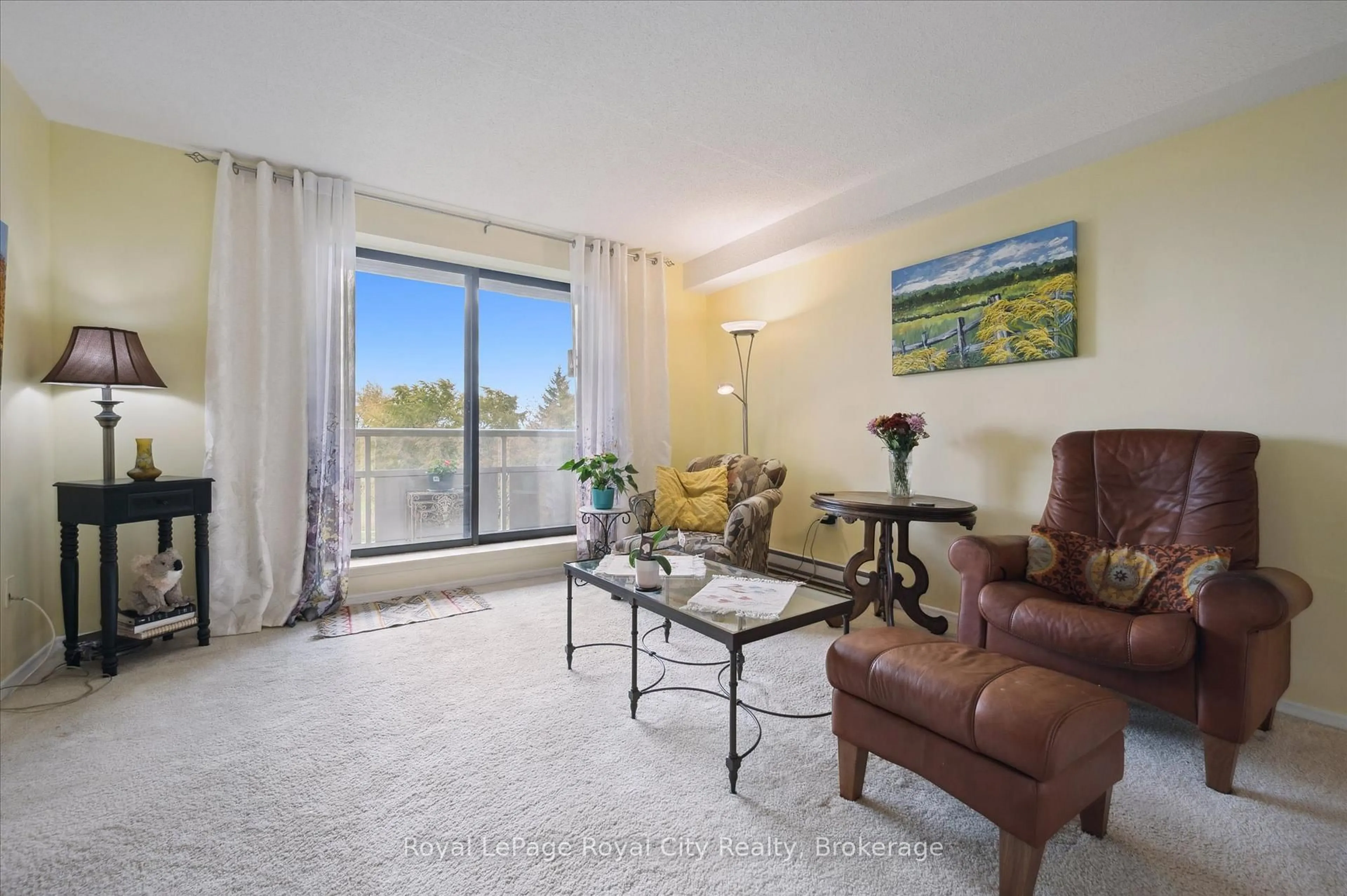 Living room with furniture, unknown for 93 Westwood Rd #403, Guelph Ontario N1H 7J7