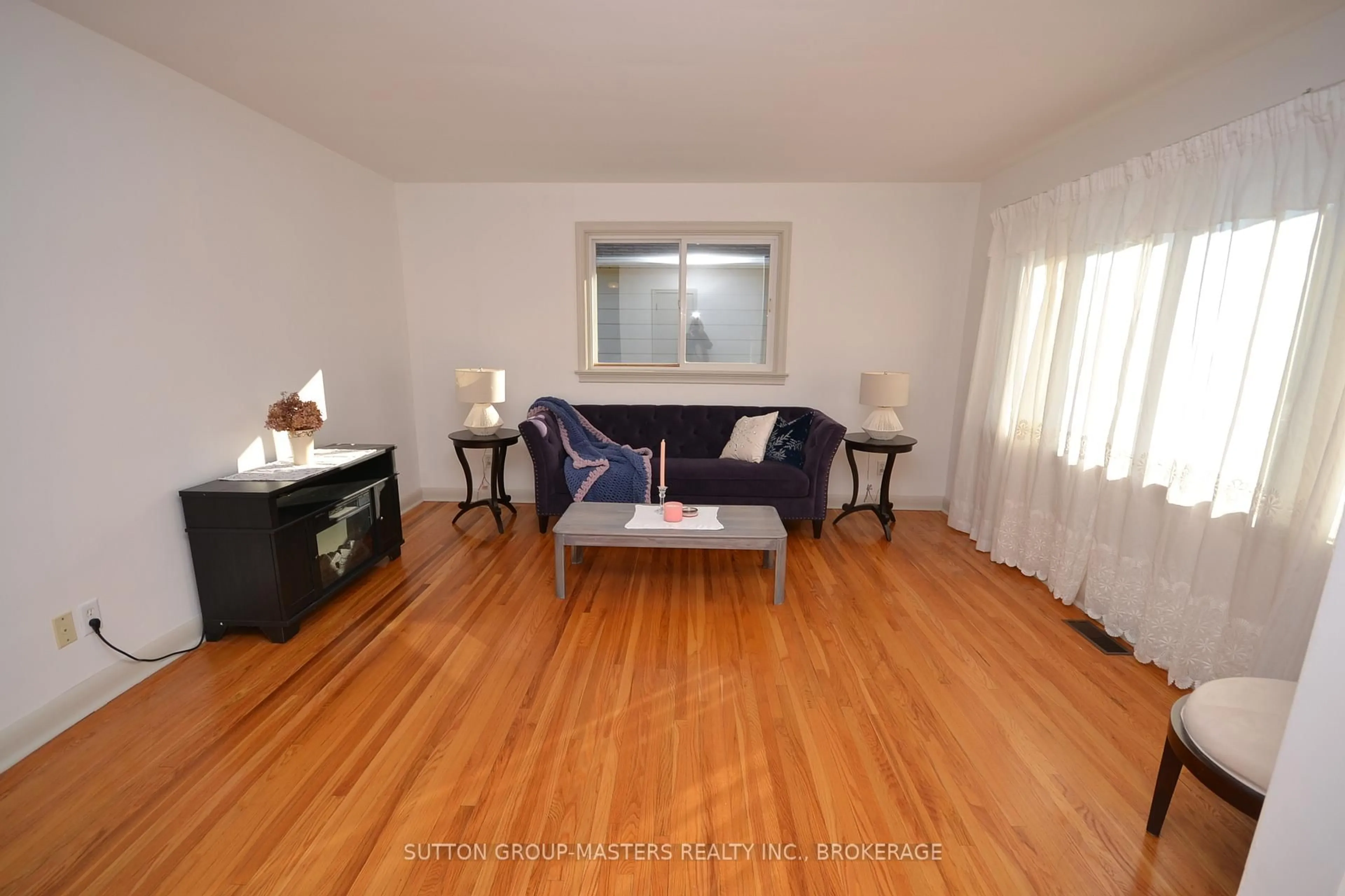 Living room with furniture, wood/laminate floor for 29 Brant Ave, Kingston Ontario K7K 4V2