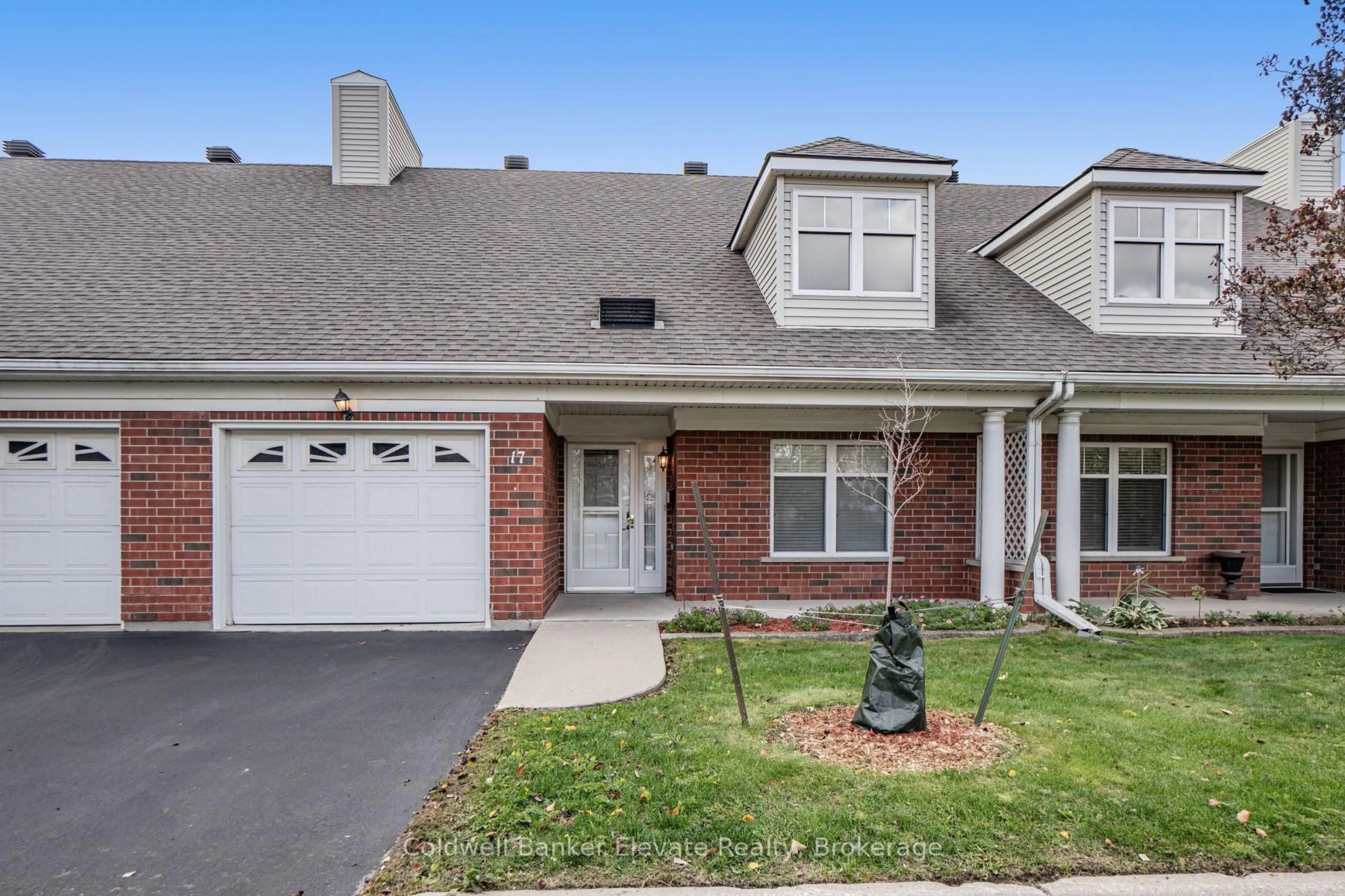 Home with brick exterior material, street for 2705 KINGSWAY Dr #17, Kitchener Ontario N2C 2T2