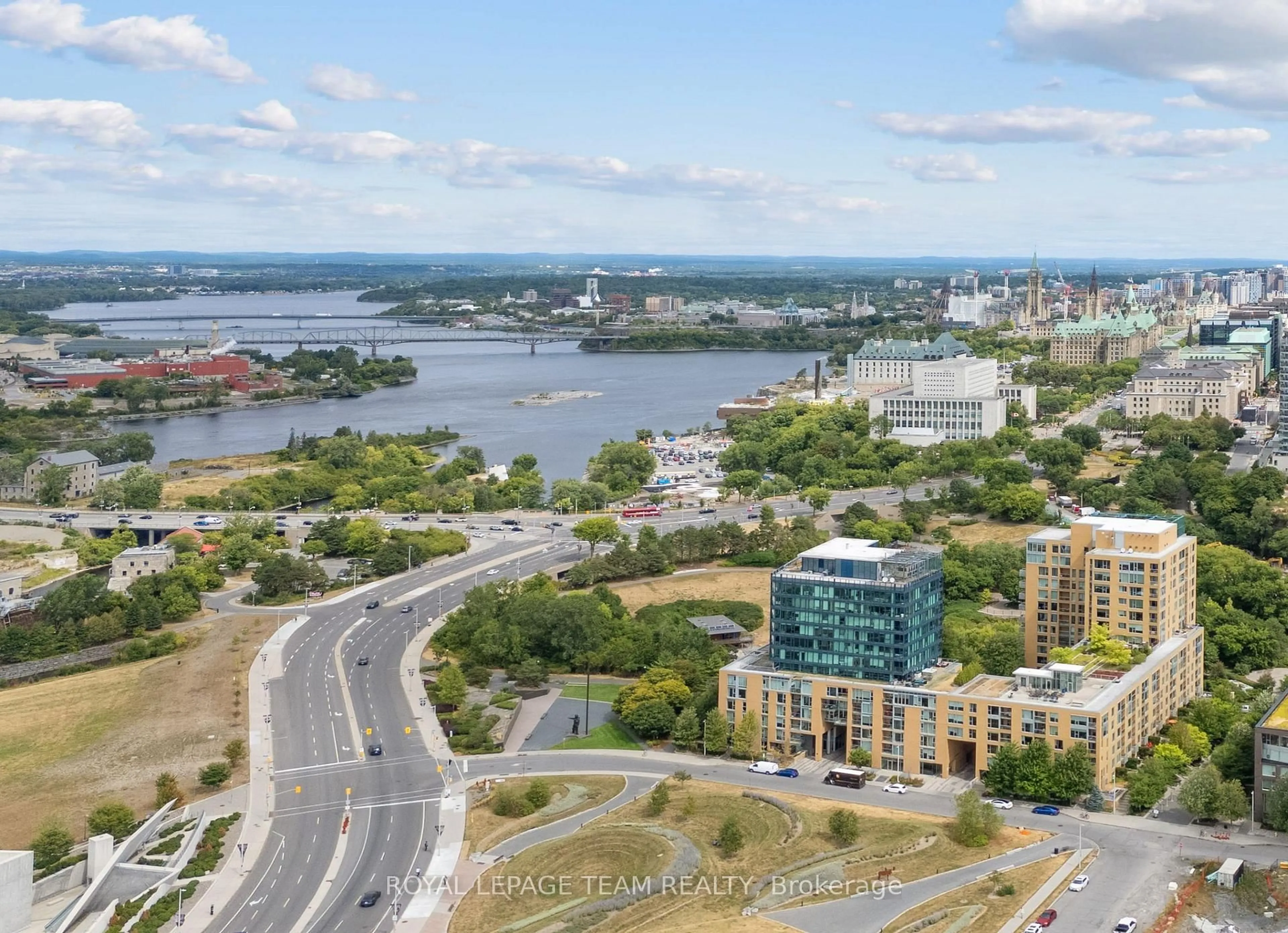 A pic from outside/outdoor area/front of a property/back of a property/a pic from drone, water/lake/river/ocean view for 200 Lett St #303, Ottawa Ontario K1R 0A7