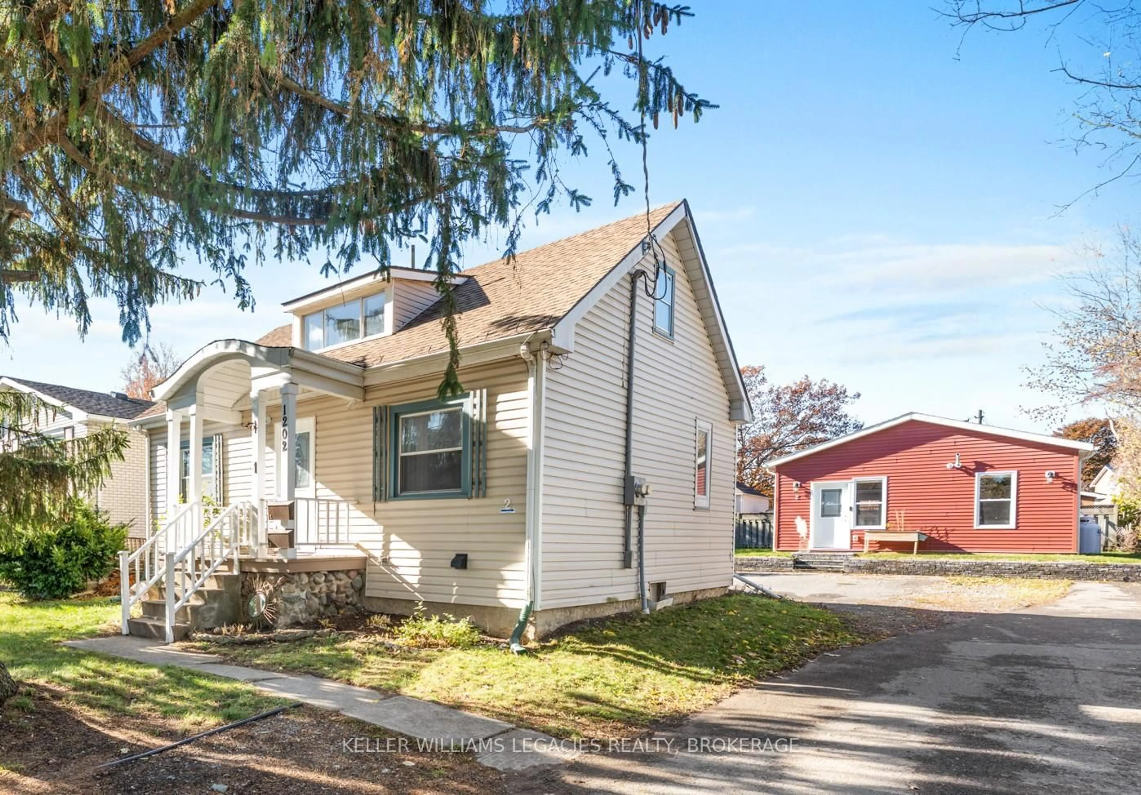 Home with vinyl exterior material, street for 1202 MONTREAL St, Kingston Ontario K7K 3L1