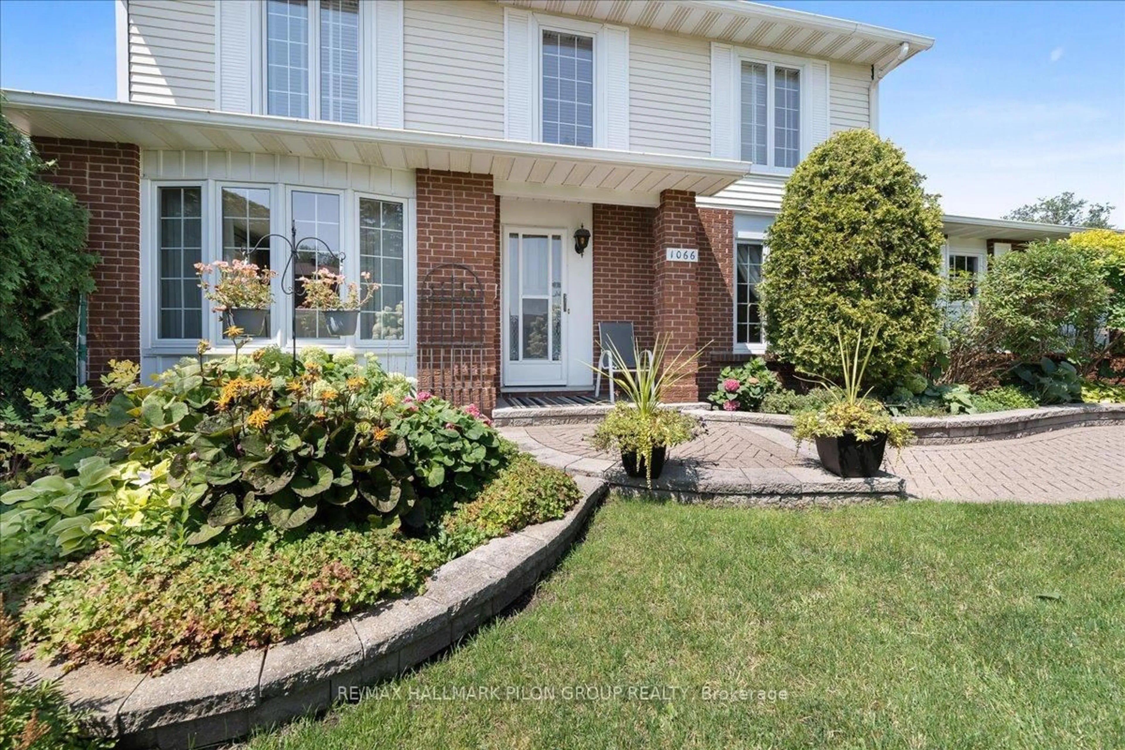 Home with brick exterior material, street for 1066 Taffy Lane, Ottawa Ontario K1C 1Y5