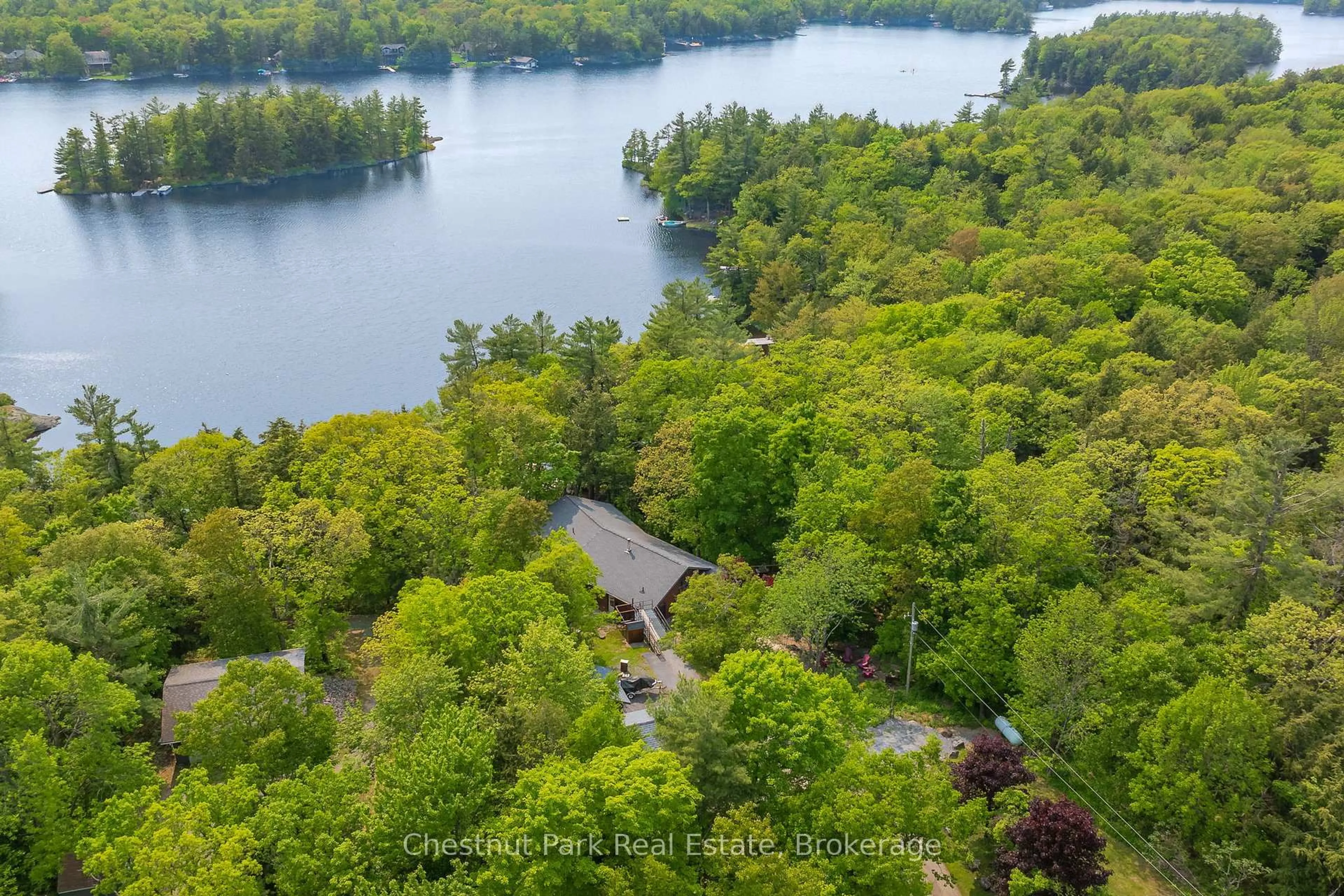 A pic from outside/outdoor area/front of a property/back of a property/a pic from drone, water/lake/river/ocean view for 1143 Leonard Lake 1 Rd, Muskoka Lakes Ontario P1L 2G7
