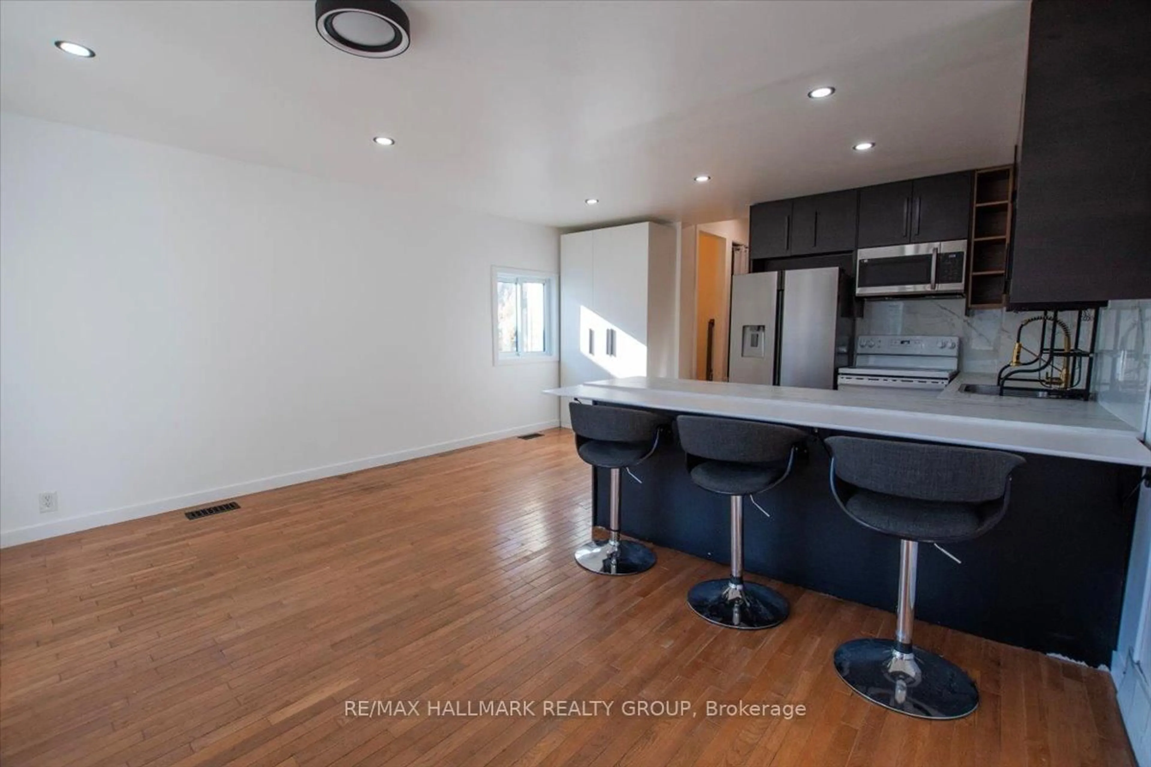 Open concept kitchen, wood/laminate floor for 367 Princess St, North Bay Ontario P1B 6C7