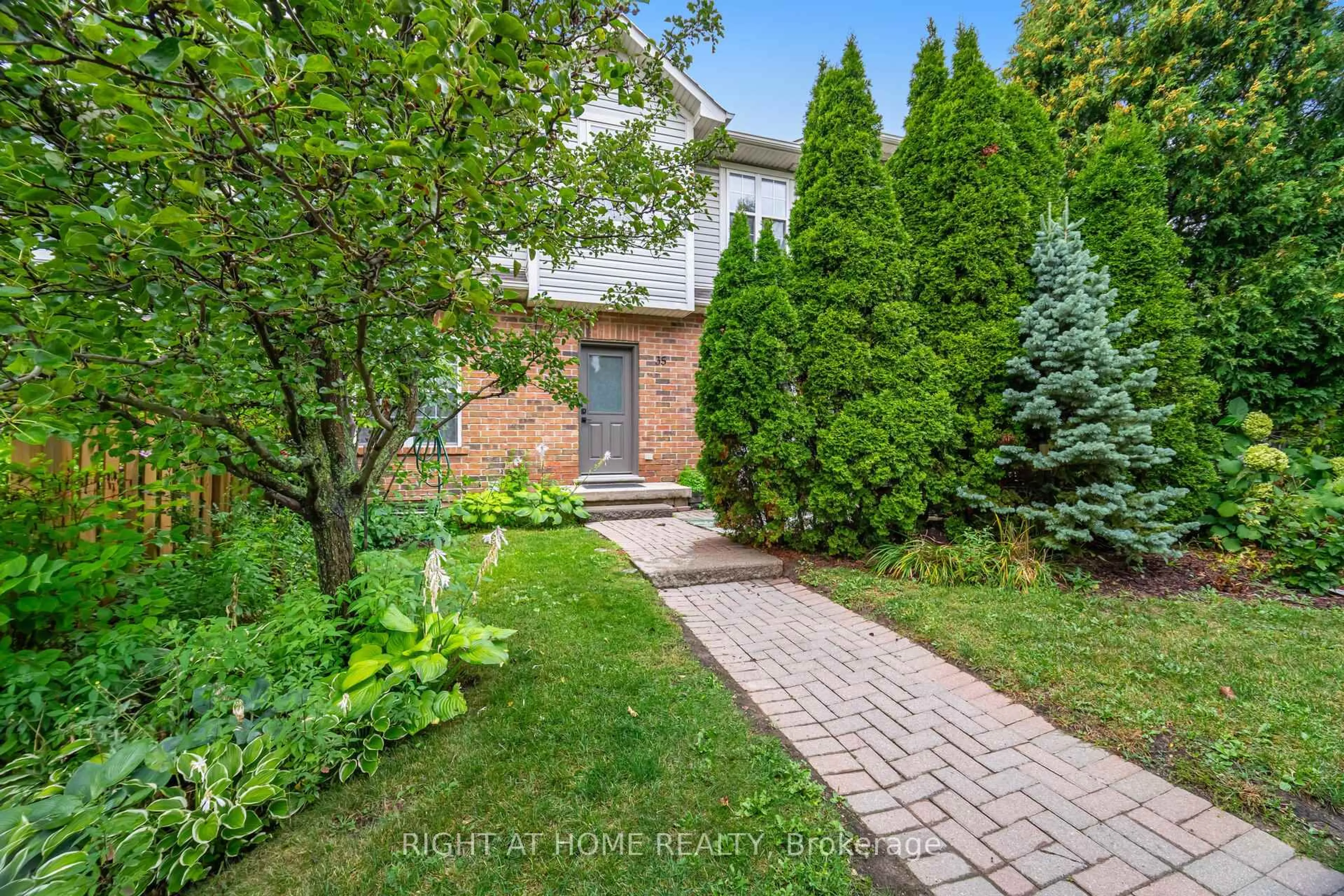 Home with brick exterior material, street for 1085 Harrogate Dr #35, Hamilton Ontario L9K 1R2