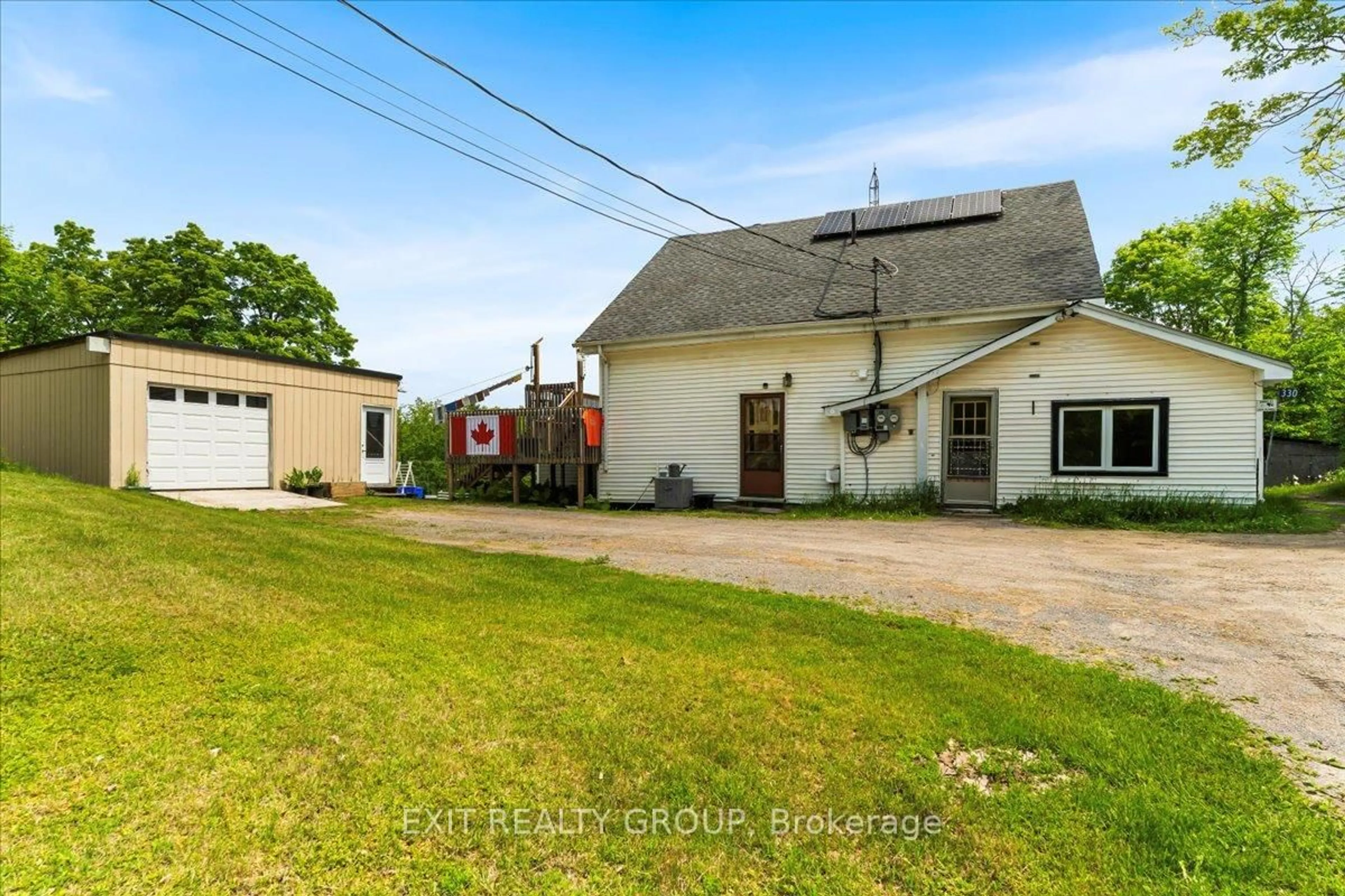 A pic from outside/outdoor area/front of a property/back of a property/a pic from drone, street for 330 Black River Rd, Tweed Ontario K0K 3J0