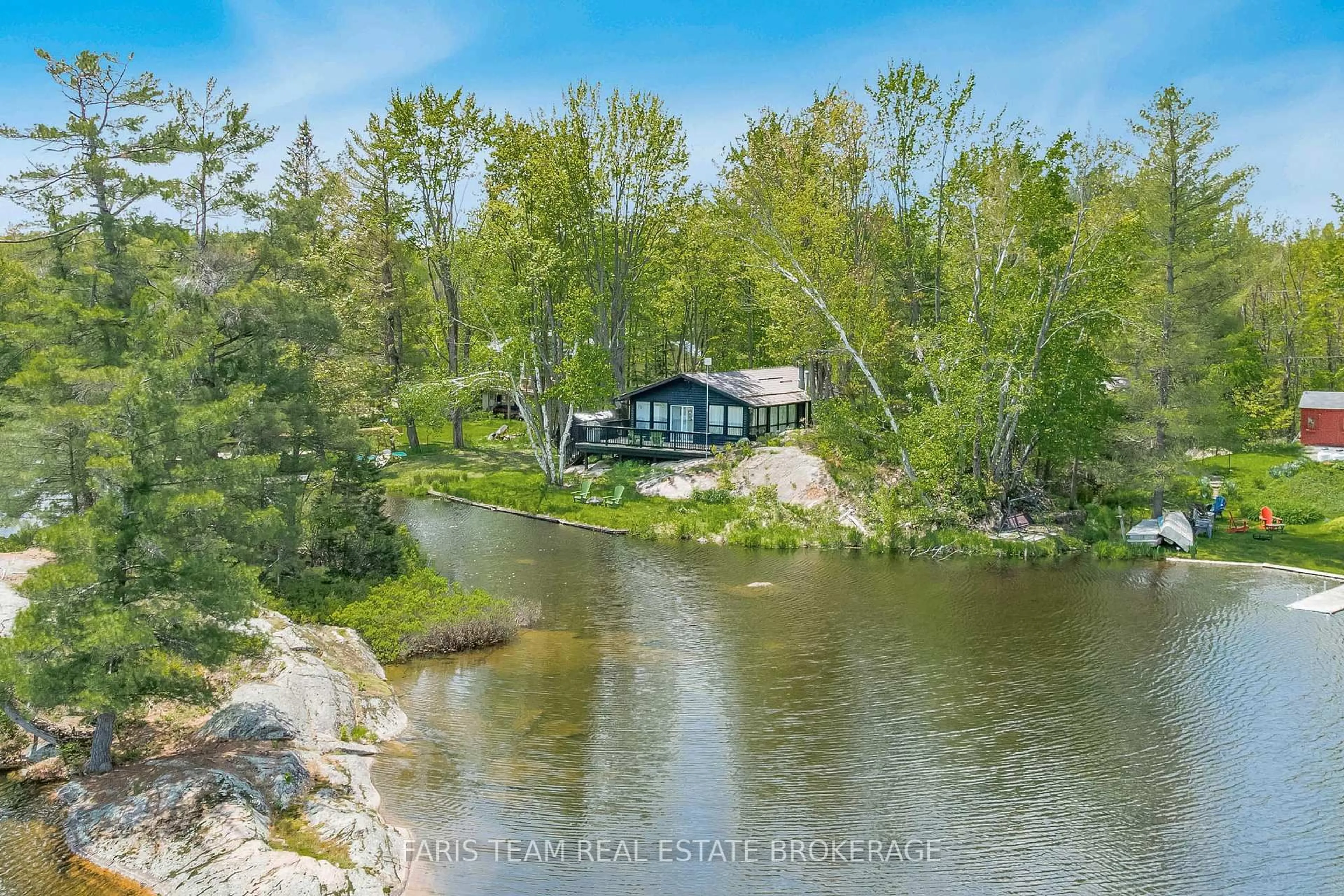 A pic from outside/outdoor area/front of a property/back of a property/a pic from drone, water/lake/river/ocean view for 1010 Sanderson Rd, Gravenhurst Ontario P0E 1N0