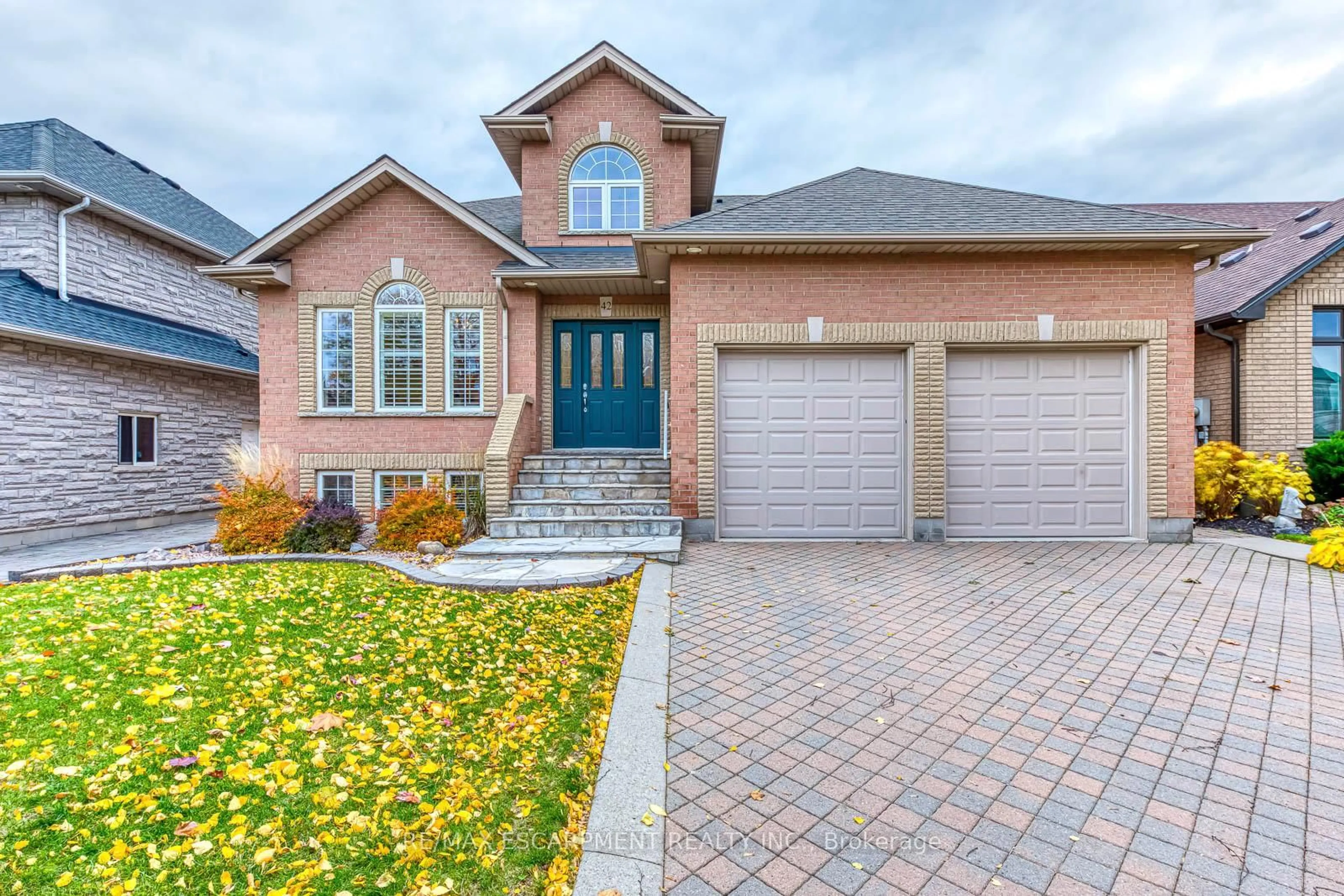 Home with brick exterior material, street for 42 Creanona Blvd, Hamilton Ontario L8E 5T2