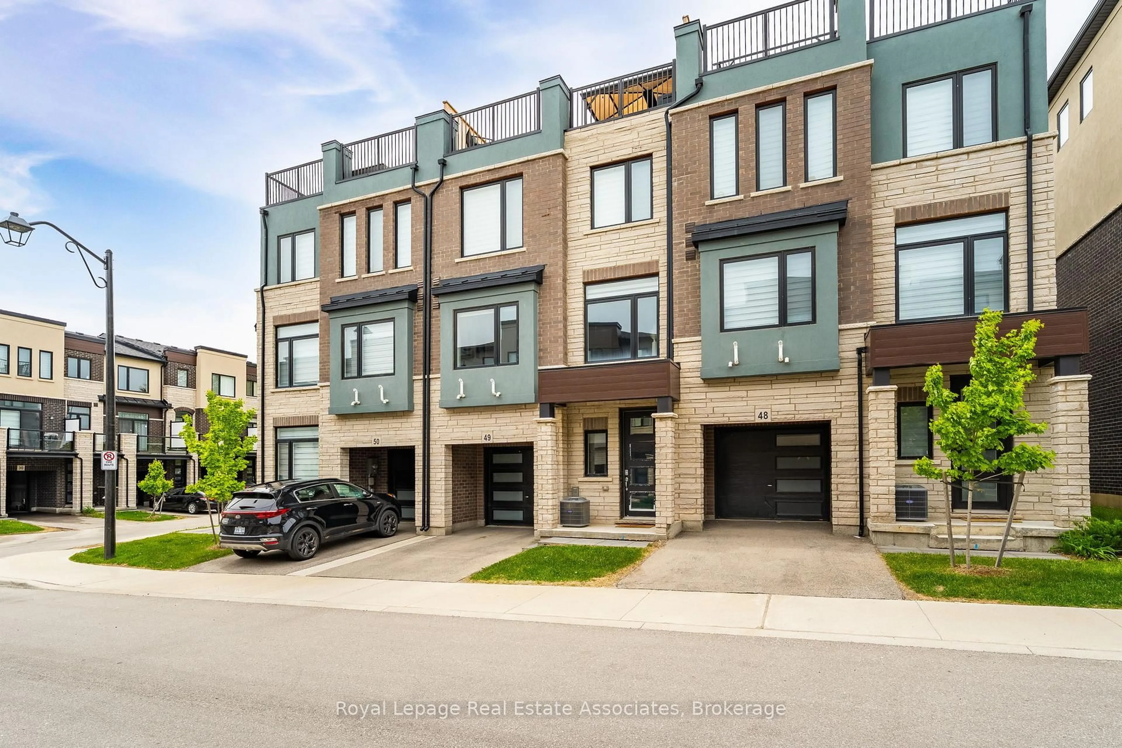 Home with brick exterior material, street for 314 Equestrian Way #49, Cambridge Ontario N3E 0E4