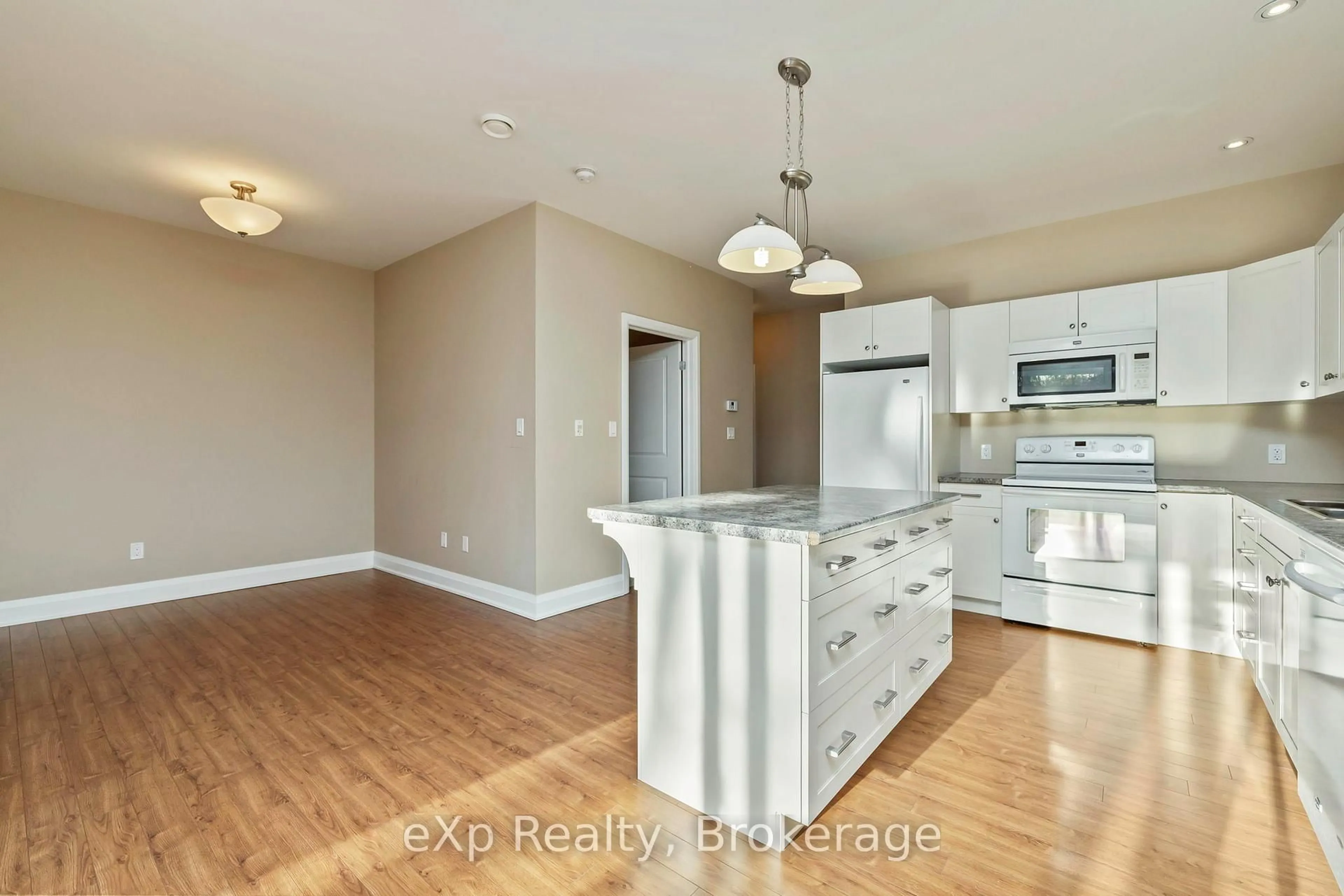 Open concept kitchen, wood/laminate floor for 20D Silver Birch Crt #308, Parry Sound Ontario P2A 0A7