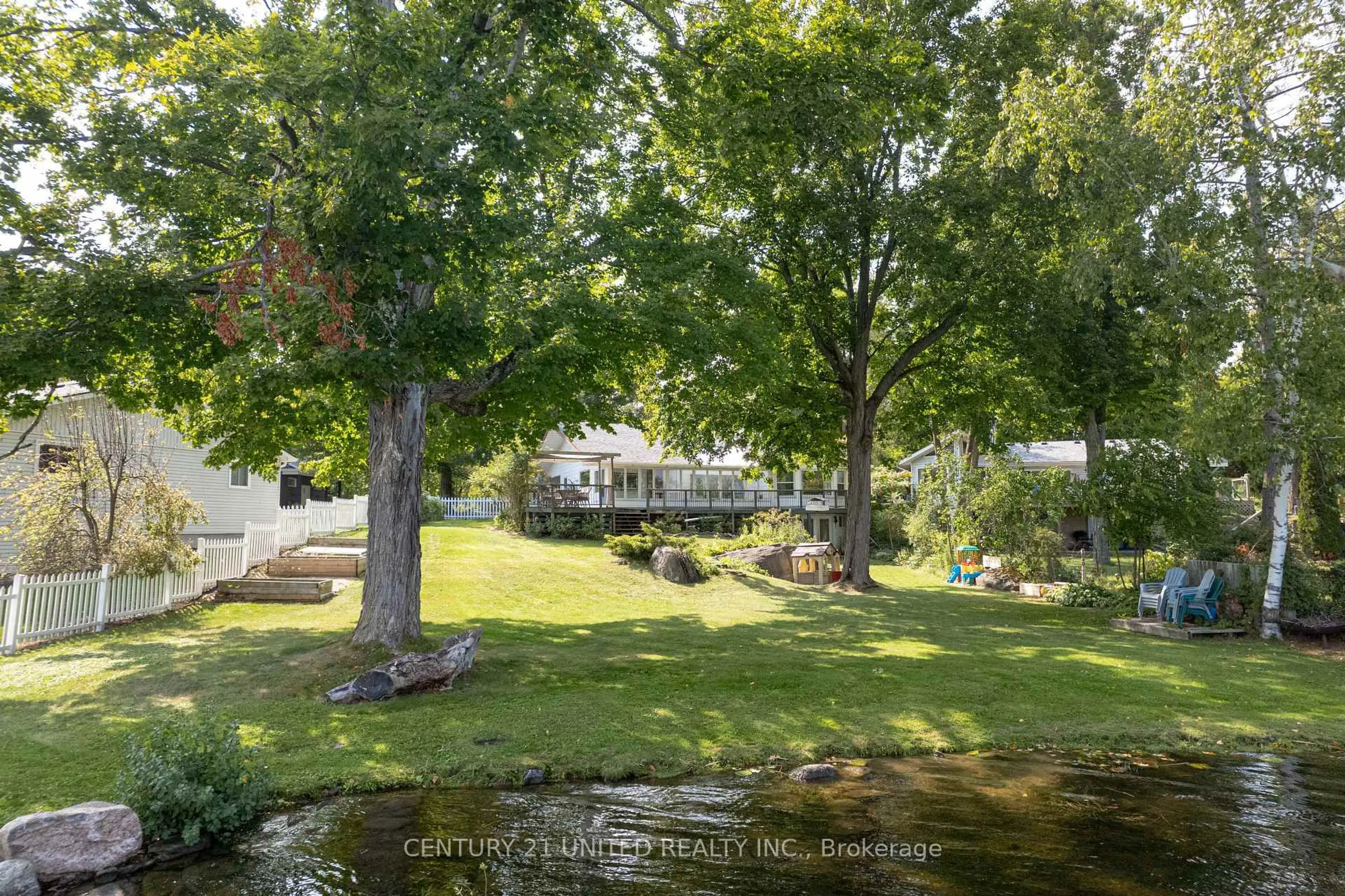 A pic from outside/outdoor area/front of a property/back of a property/a pic from drone, water/lake/river/ocean view for 1105 Primrose Lane, Selwyn Ontario K9J 6X5