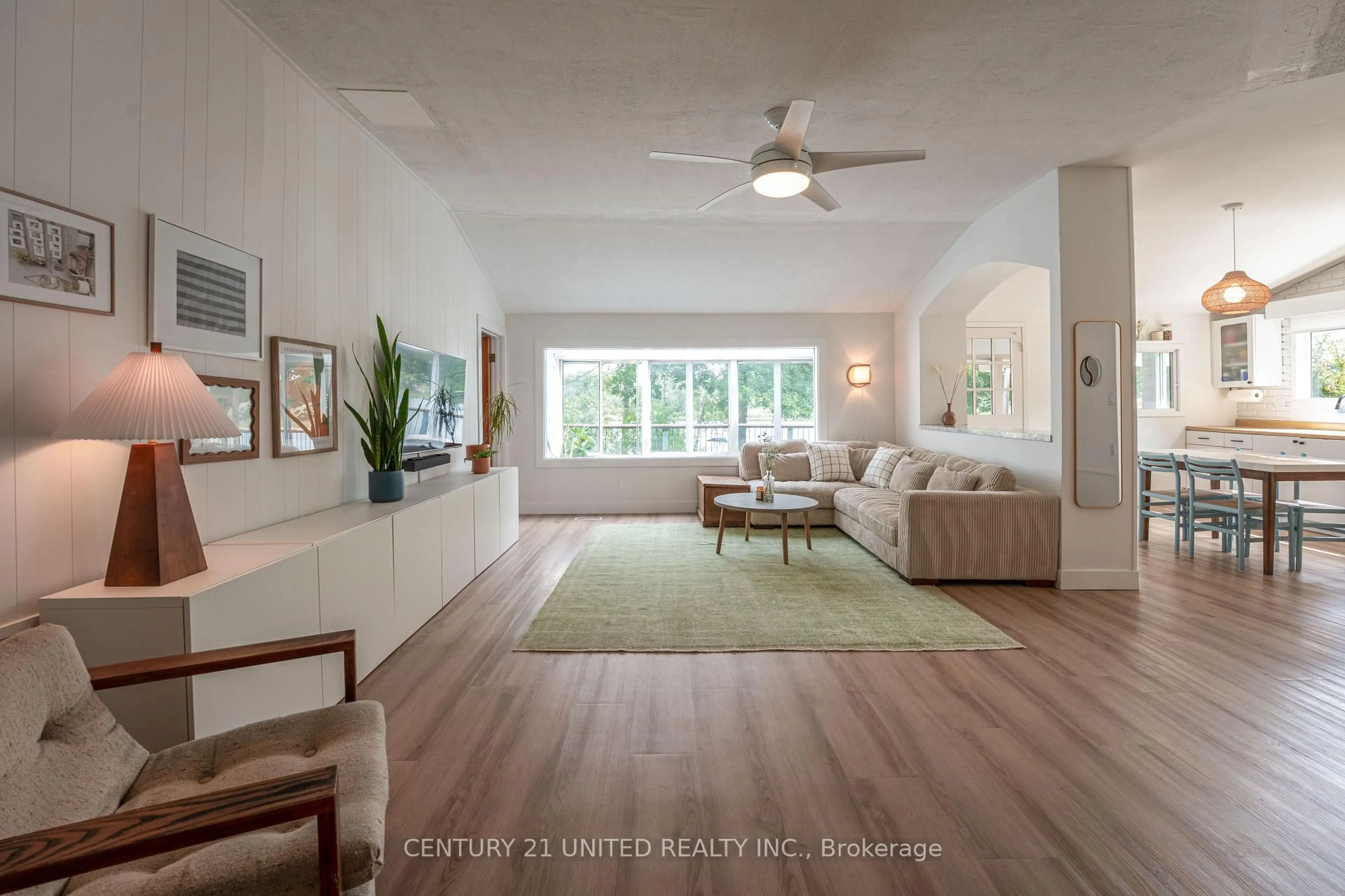 Living room with furniture, wood/laminate floor for 1105 Primrose Lane, Selwyn Ontario K9J 6X5