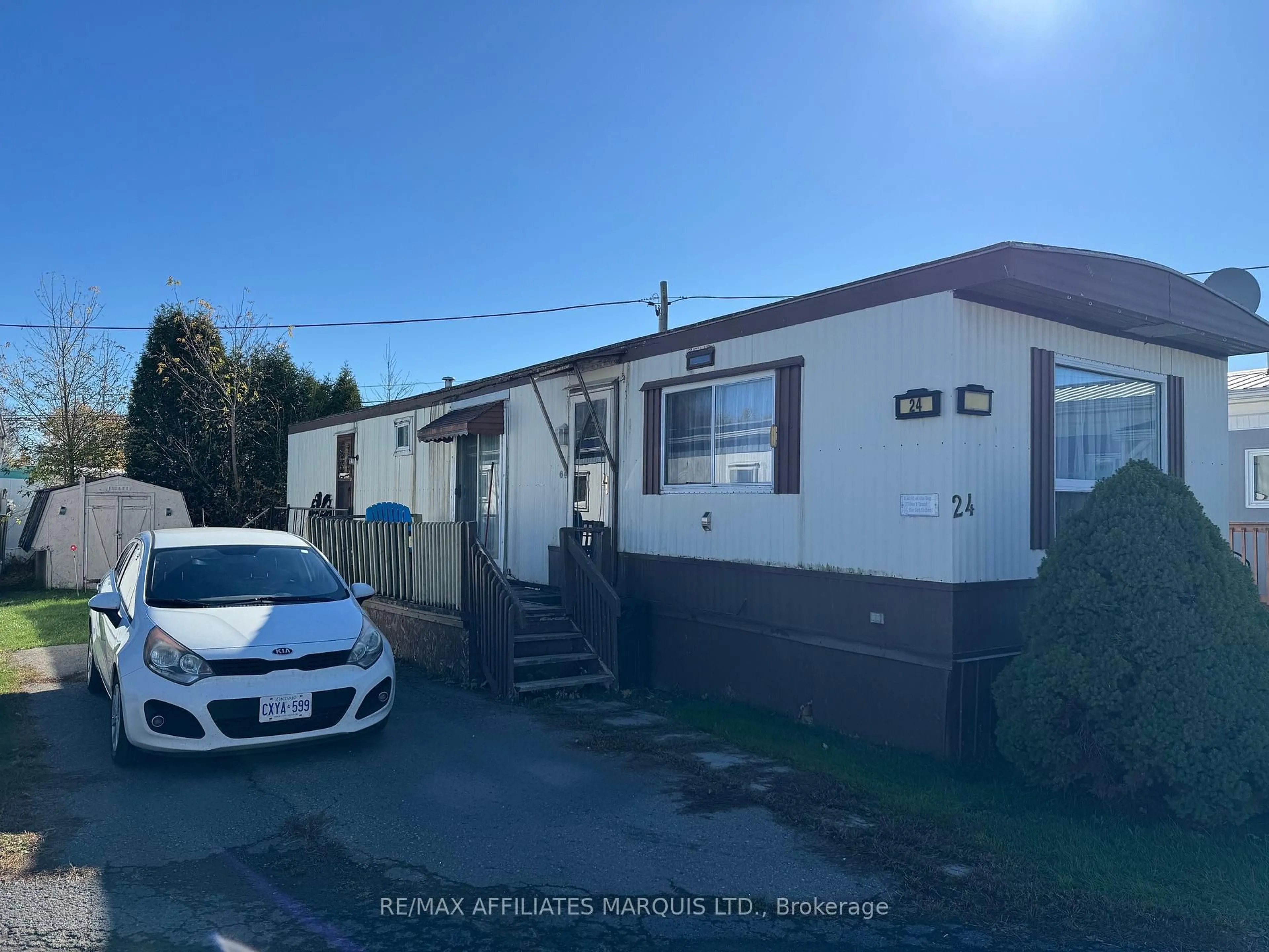 A pic from outside/outdoor area/front of a property/back of a property/a pic from drone, street for 25 County Road 31 Rd ##24, South Dundas Ontario K0C 1X0