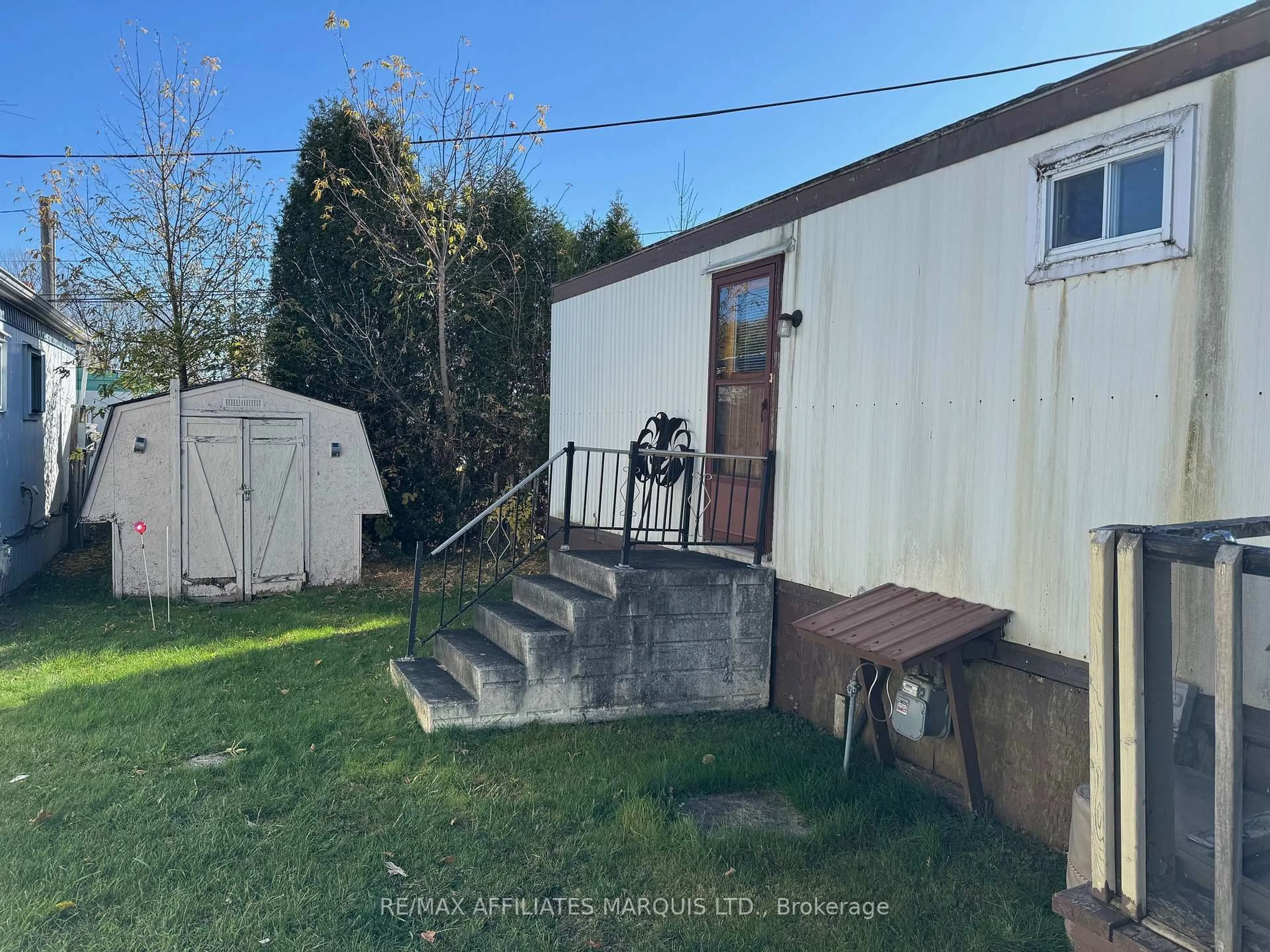 A pic from outside/outdoor area/front of a property/back of a property/a pic from drone, street for 25 County Road 31 Rd ##24, South Dundas Ontario K0C 1X0