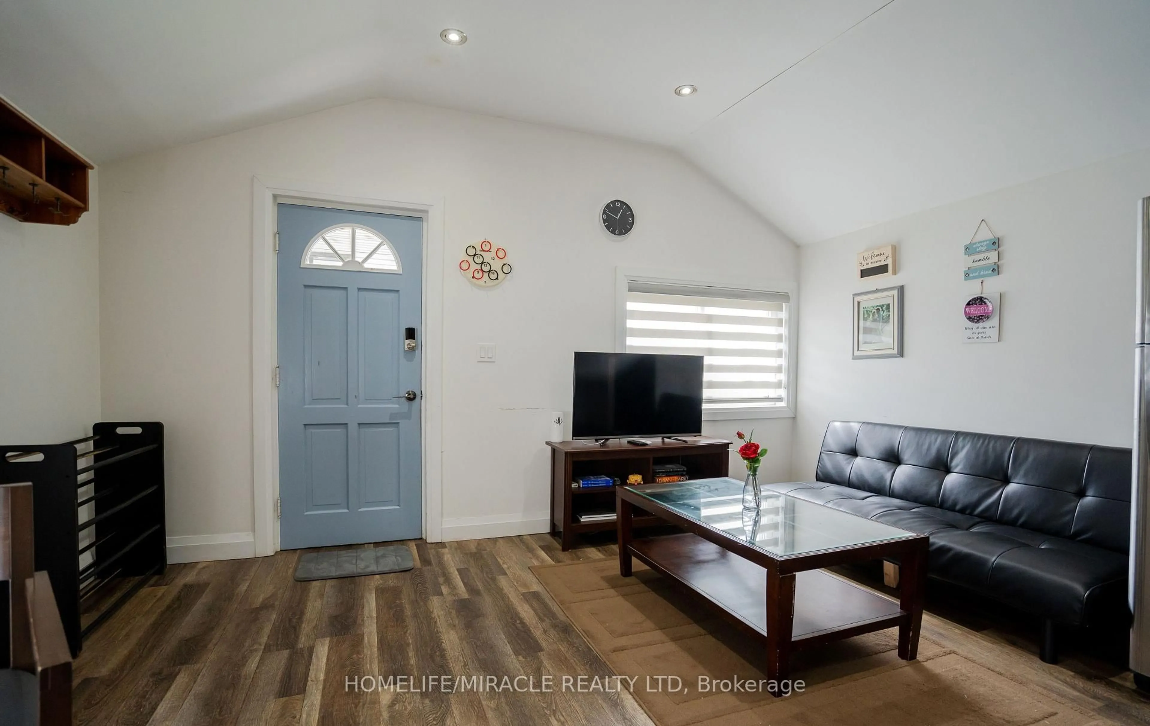 Living room with furniture, wood/laminate floor for 6483 Ash St, Niagara Falls Ontario L2G 2H4