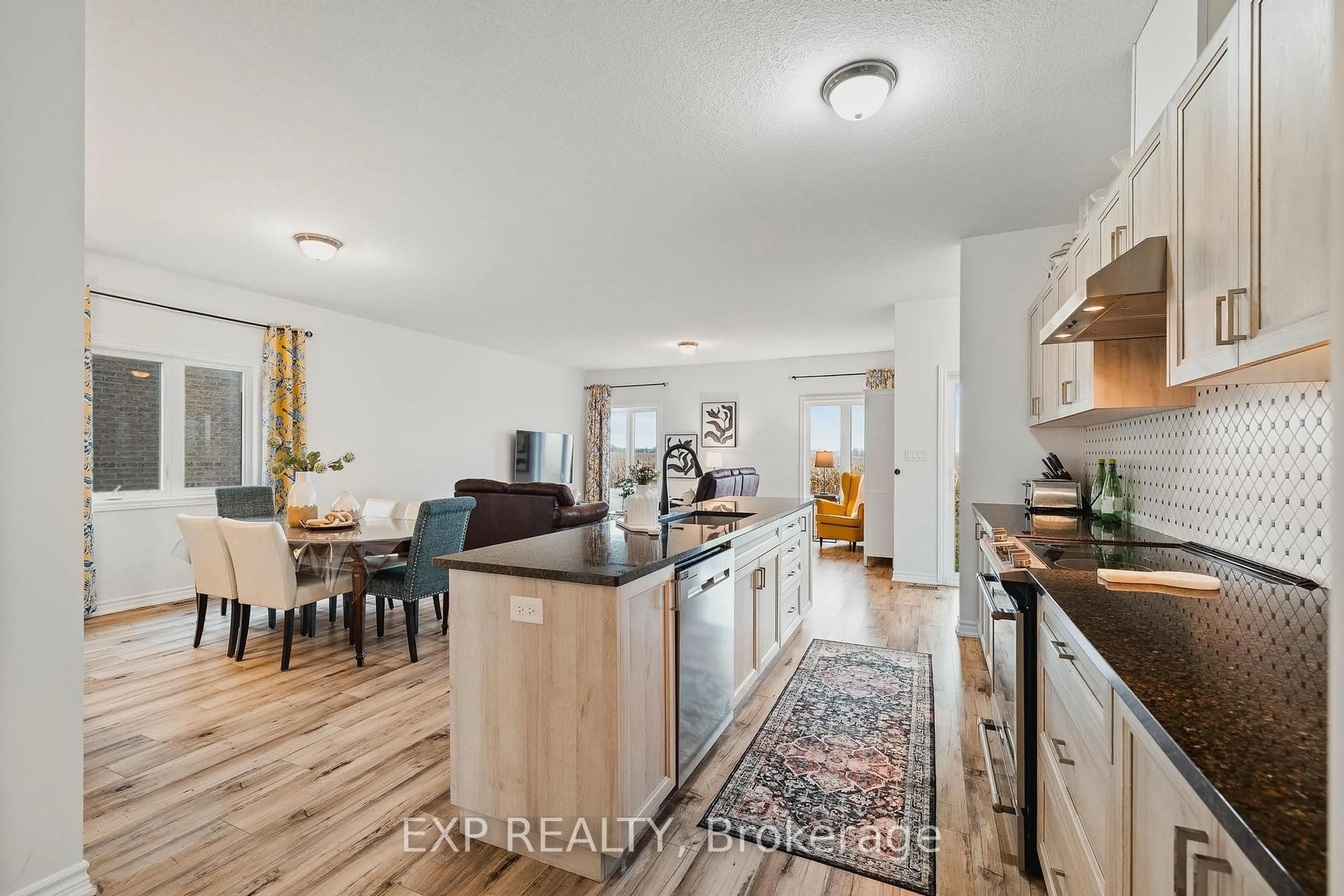 Open concept kitchen, wood/laminate floor for 126 Maple St, Mapleton Ontario N0G 1P0