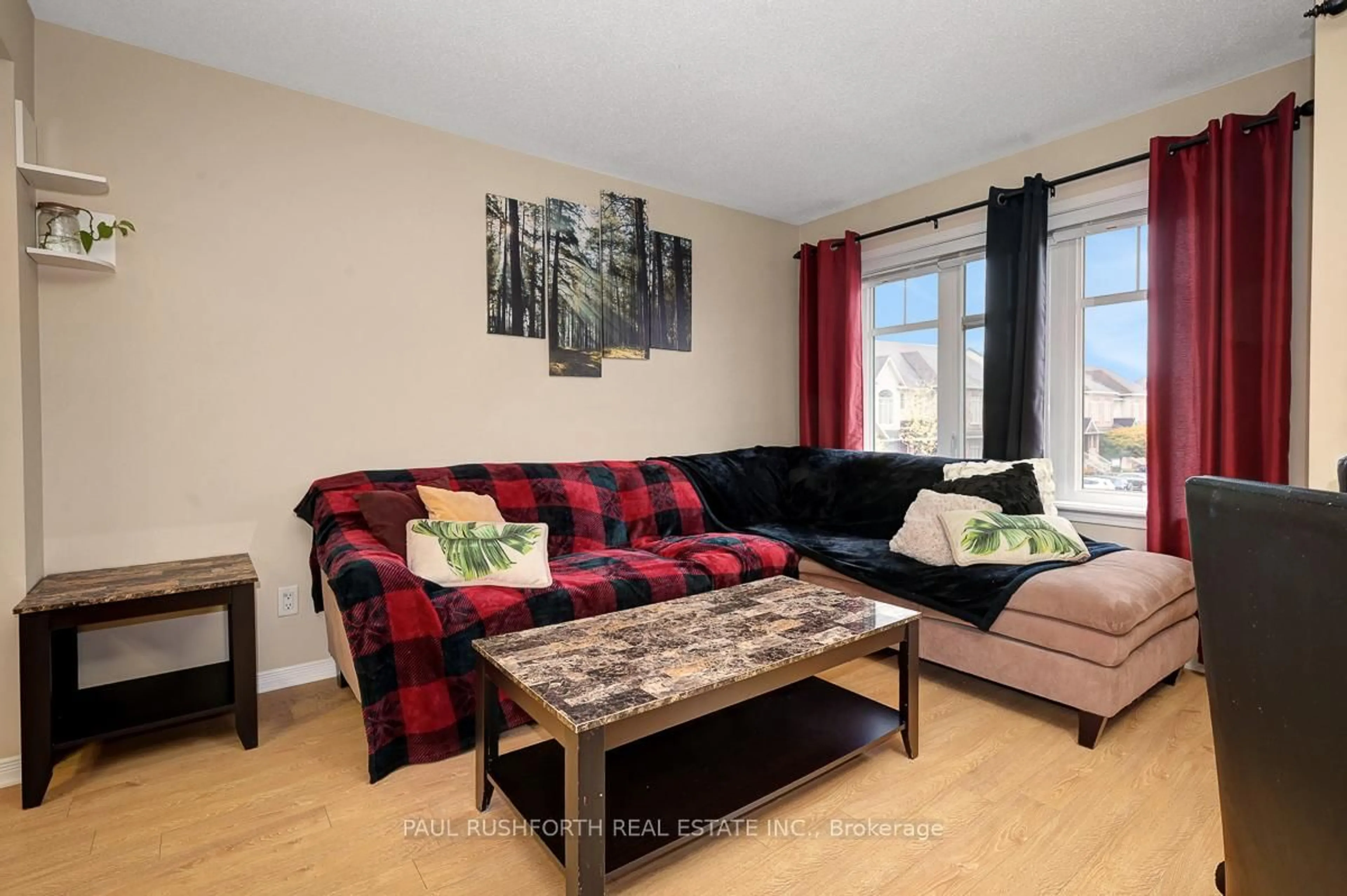 Living room with furniture, wood/laminate floor for 117 Keltie Private, Ottawa Ontario K2J 0A1