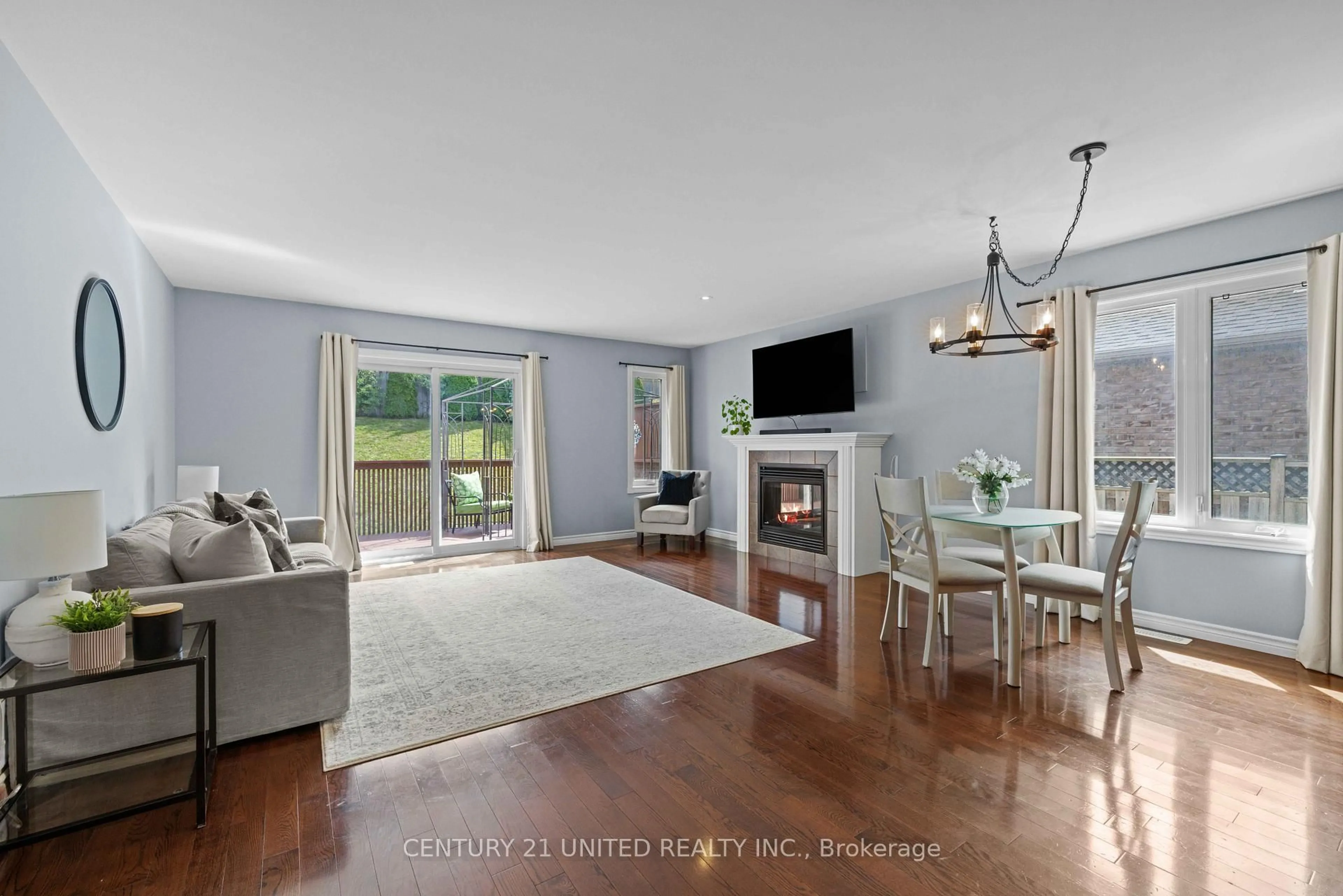 Living room with furniture, wood/laminate floor for 385 Bianco Cres, Peterborough Ontario K9K 0A5