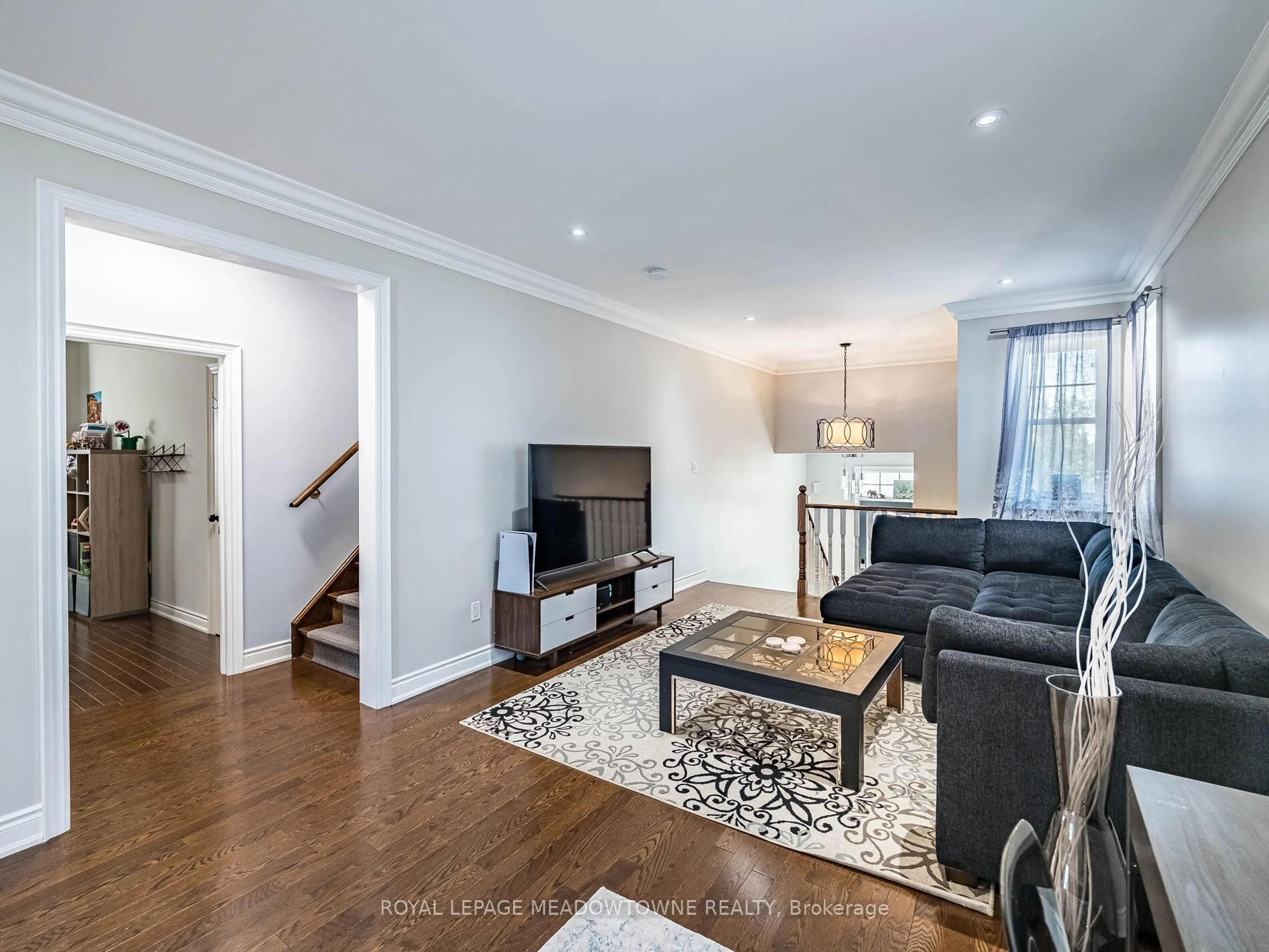 Living room with furniture, wood/laminate floor for 543 Wansbrough Way, Shelburne Ontario L9V 2S6