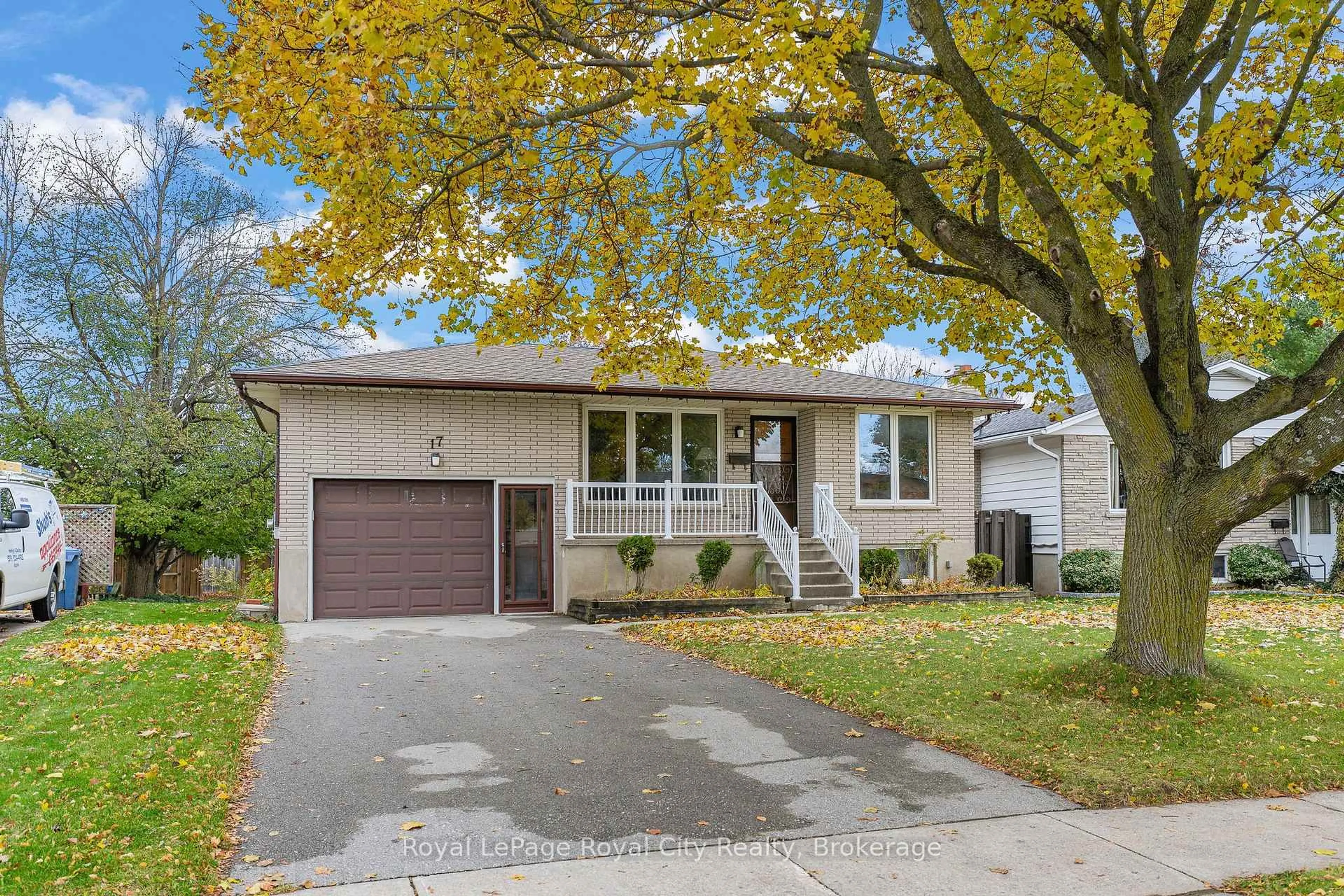 Home with vinyl exterior material, street for 17 Muskoka Dr, Guelph Ontario N1E 6E1