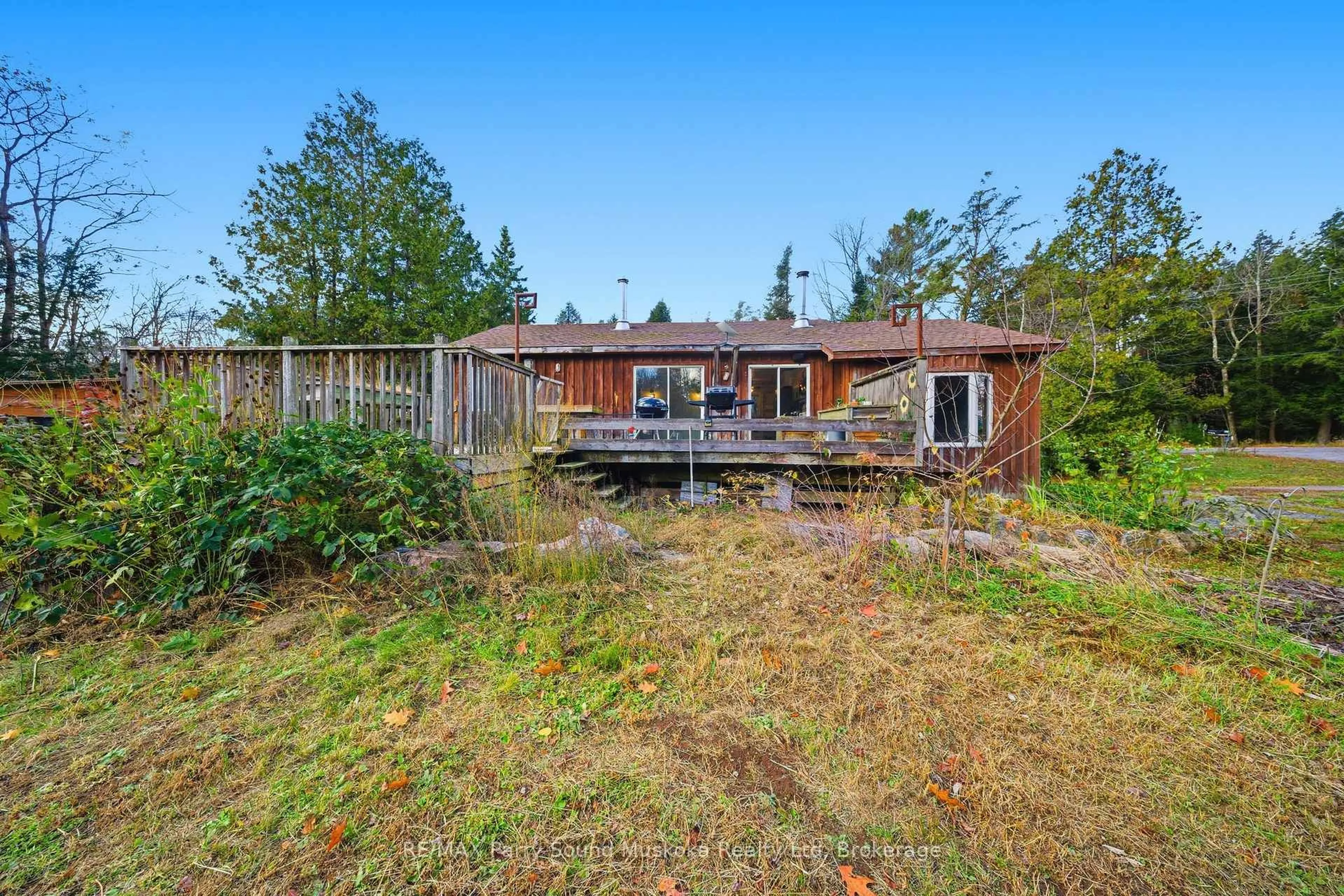 A pic from outside/outdoor area/front of a property/back of a property/a pic from drone, forest/trees view for 66 Clear Lake Rd, Seguin Ontario P0C 1H0