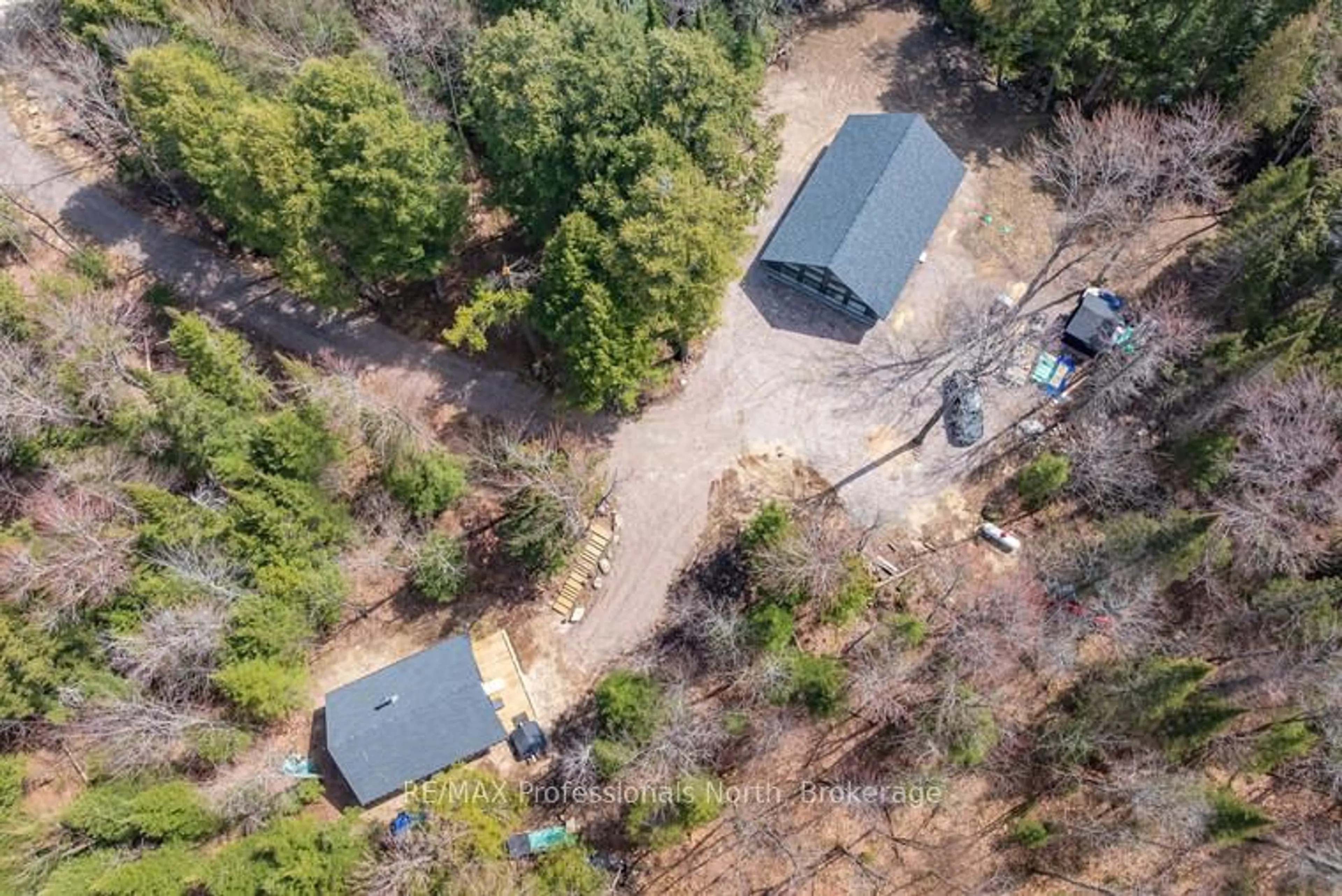 A pic from outside/outdoor area/front of a property/back of a property/a pic from drone, forest/trees view for 1820 Riding Ranch Rd, Machar Ontario P0A 1X0