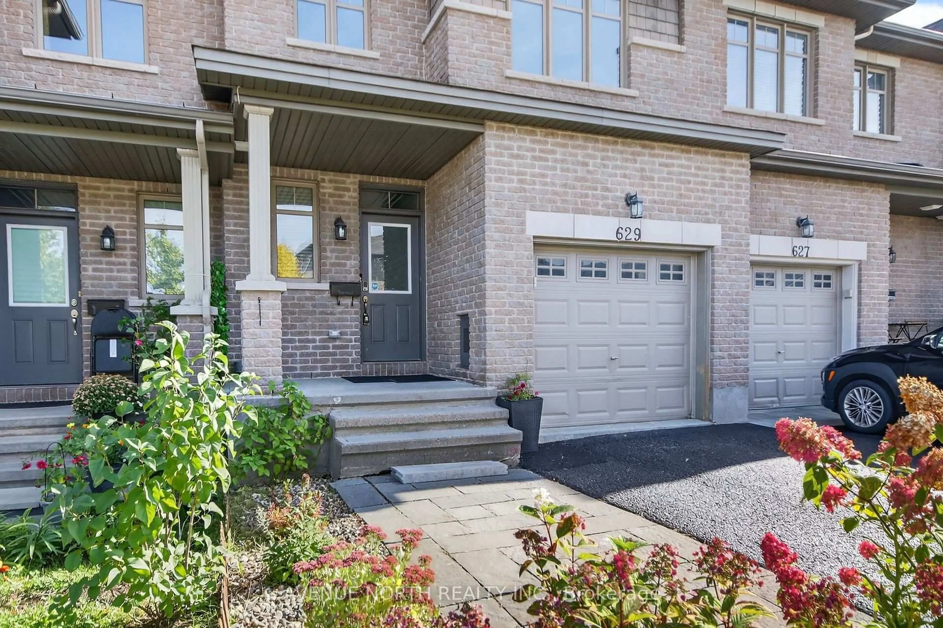 Home with brick exterior material, street for 629 Sunburst St, Ottawa Ontario K1T 0L1