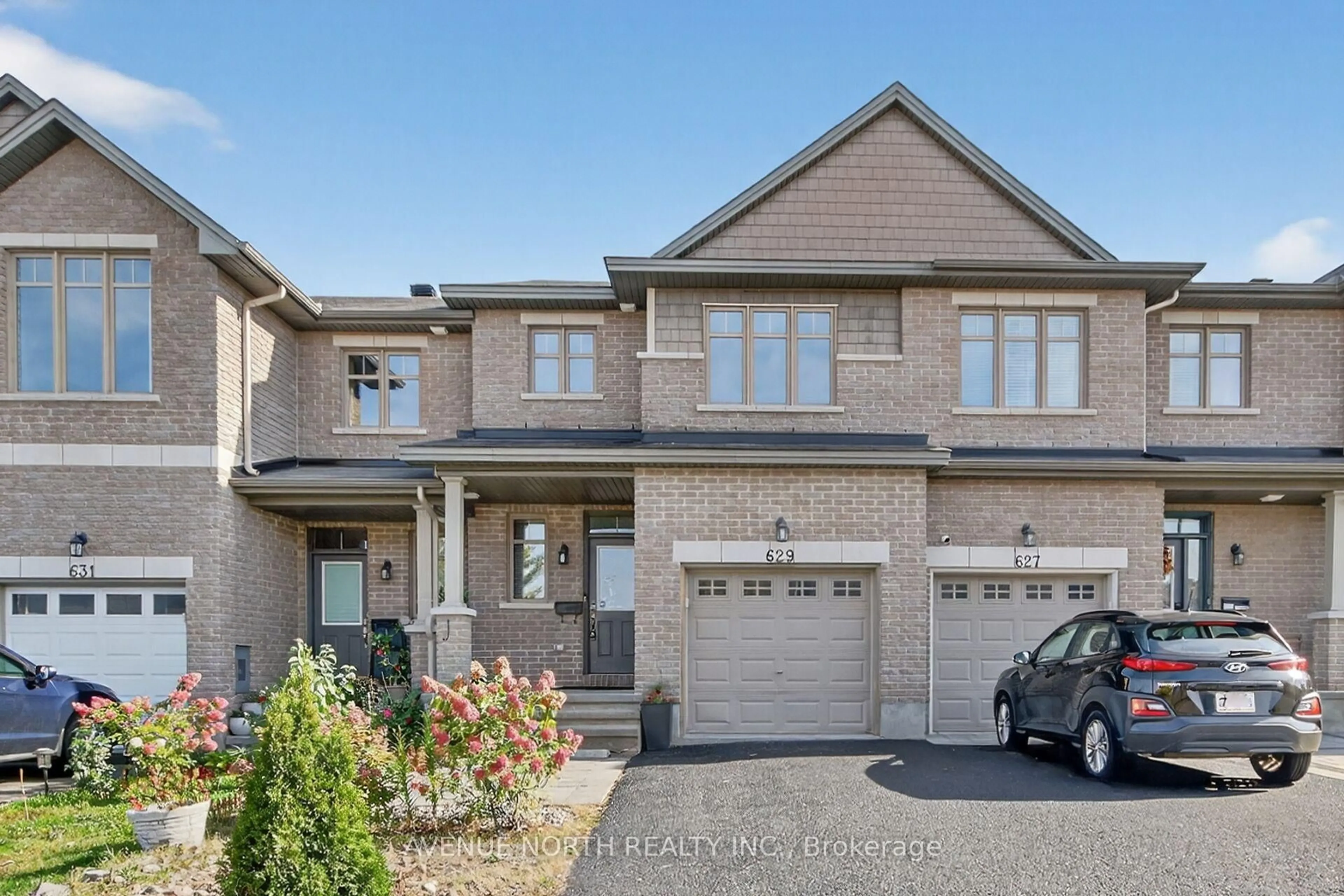 Home with brick exterior material, street for 629 Sunburst St, Ottawa Ontario K1T 0L1